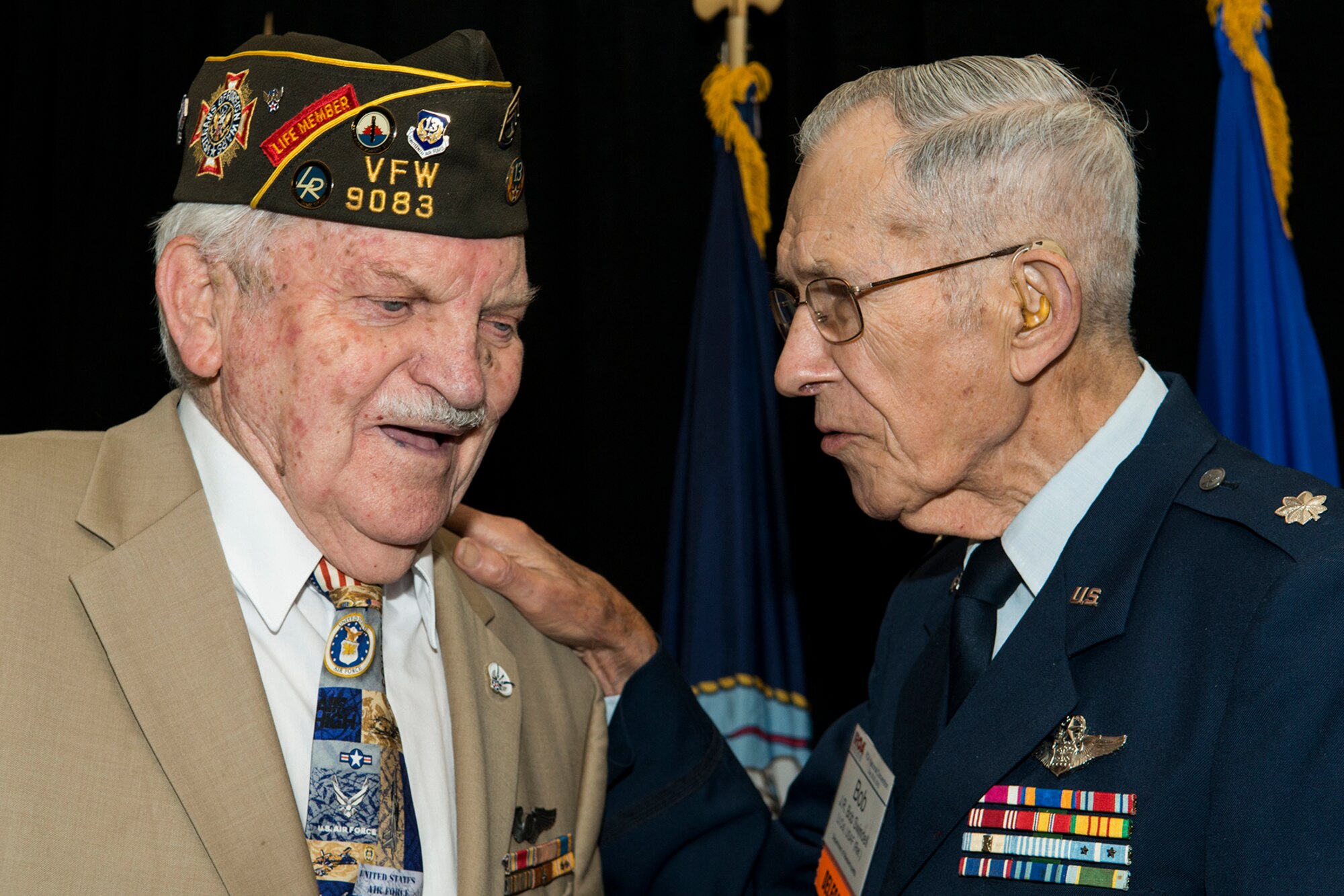 Retired Tech. Sgt. John Wright and retired Brig. Gen. James Swindell talk following the unveiling ceremony for the painting “Deterrence on Demand”, Washington D.C., July 27, 2015. Wright is a former World War II B-24 Liberator radar operator assigned to the 307th Bombardment Group, and Swindell was assigned to the 307th Bomb Wing during the Korean War and was a B-29 Superfortress navigator. (U.S. Air Force photo by Master Sgt. Greg Steele/Released)