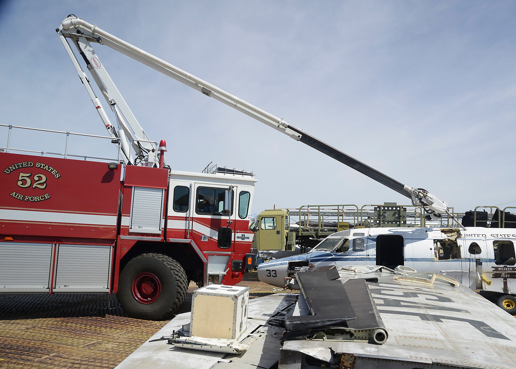Piercing the fuselage, the penetrating boom provides a direct way to transport water onto fires within the aircraft. (U.S. Air Force photo by Patric Lovato)