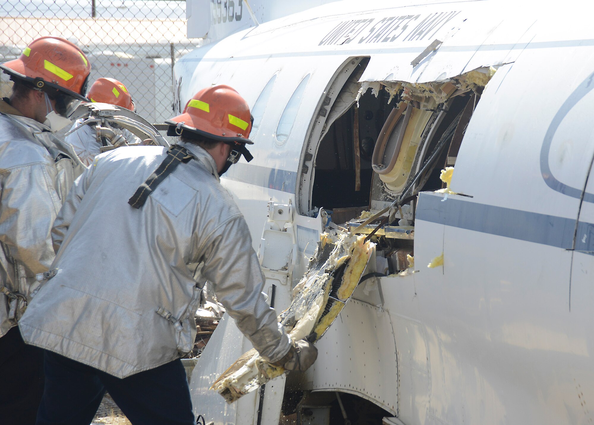 The hole in the plane is made large enough for rescuers to reach victims who may be inside. (U.S. Air Force photo by Patric Lovato)