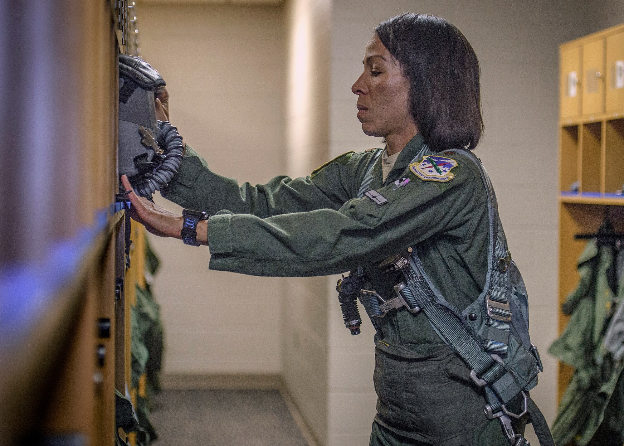 Maj. Christina Hopper, a 5th Flying Training Squadron instructor pilot, preps for an upcoming instruction flight at the life support building at Vance Air Force Base, Oklahoma, July 20. (U.S. Air Force photo / David Poe)