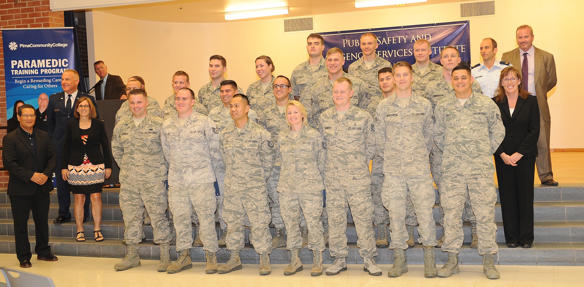U.S. Air Force Airmen from around the country gather together after graduating the paramedic training course at the Pima Community College Public Safety Emergency and Services Institute, Tucson, Ariz., July 31, 2015. These Airmen went through four months of didactic and field training to become nationally registered paramedics. The PSESI is the only location that Airmen can become nationally certified paramedics. (U.S. Air Force photo by Airmen 1st class Cheyenne Morigeau/Released)