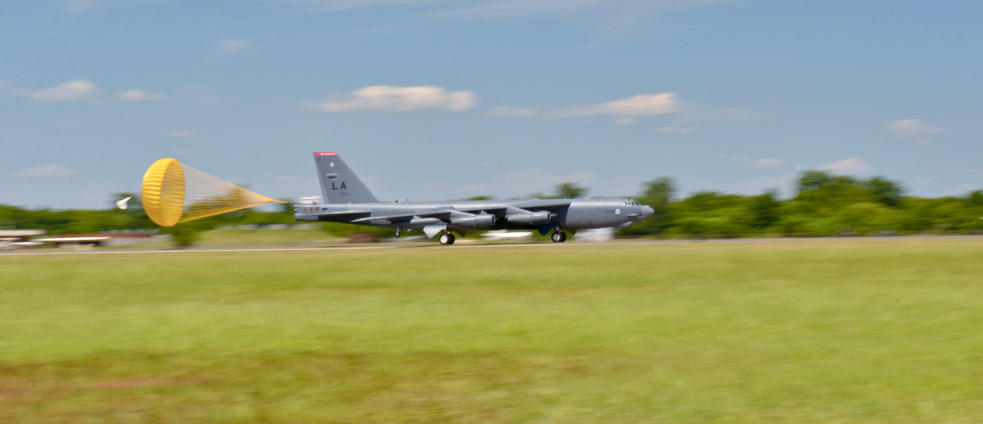 A B-52 Stratofortress releases a drag chute during a landing at Barksdale Air Force Base, La., Aug. 1, 2015. The B-52 bomber fleet provides decision makers the ability to rapidly project military and deliver decisive effects to fulfill our security requirements. (U.S. Air Force photo/Airman 1st Class Mozer O. Da Cunha) 