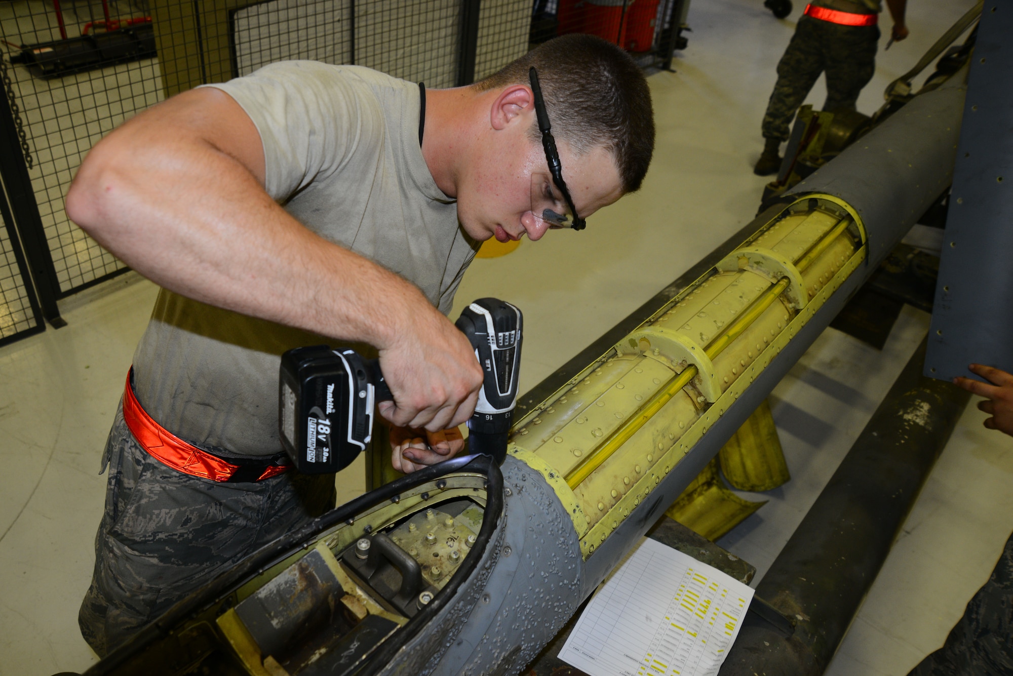Airman 1st Class Jeremiah Hatcher, 22nd Maintenance Squadron aircraft hydraulics specialist fastens a panel to a KC-135 Stratotanker boom, July 28, 2015, at McConnell Air Force Base, Kan. The boom was prepared for shipment to prevent damages and sent off to another base for a complete rebuild. (U.S. Air Force photo by Airman 1st Class Christopher Thornbury)