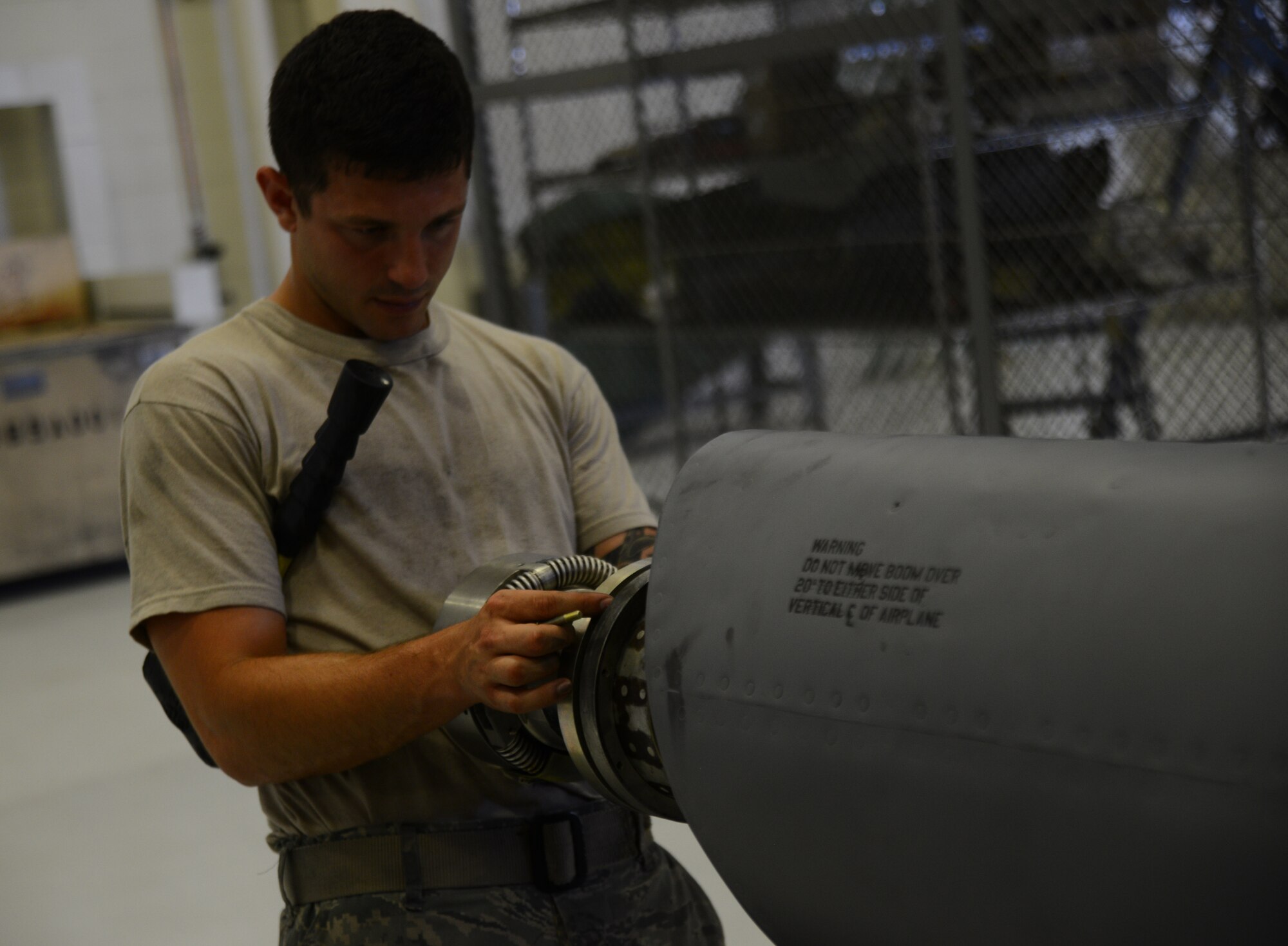 Senior Airman Zach Buccieri, 22nd Maintenance Squadron aircraft hydraulics specialist, places a nut on a KC-135 Stratotanker inner fuel tube, July 28, 2015, at McConnell Air Force Base, Kan. The nut is placed and fastened to secure the tube to ensure that nothing is moved out of place causing damaged to itself or other objects while being moved to another base. (U.S. Air Force photo by Airman 1st Class Christopher Thornbury)