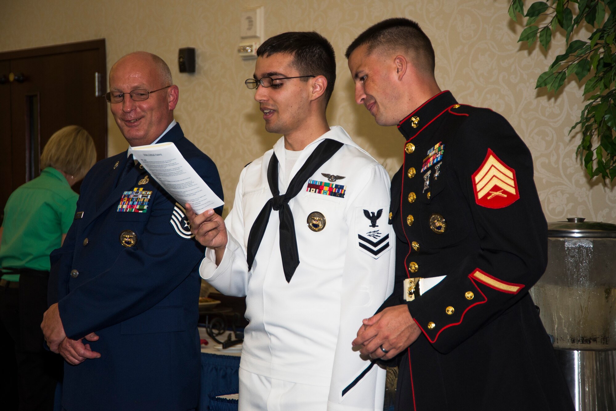 Service members sing the service medleys at the Scott Club, July, 31, 2015, at Scott Air Force Base, Illinois. The service medley incorporates all the military branches’ songs. (U. S. Air Force photo by Airman 1st Class Melissa Estevez)