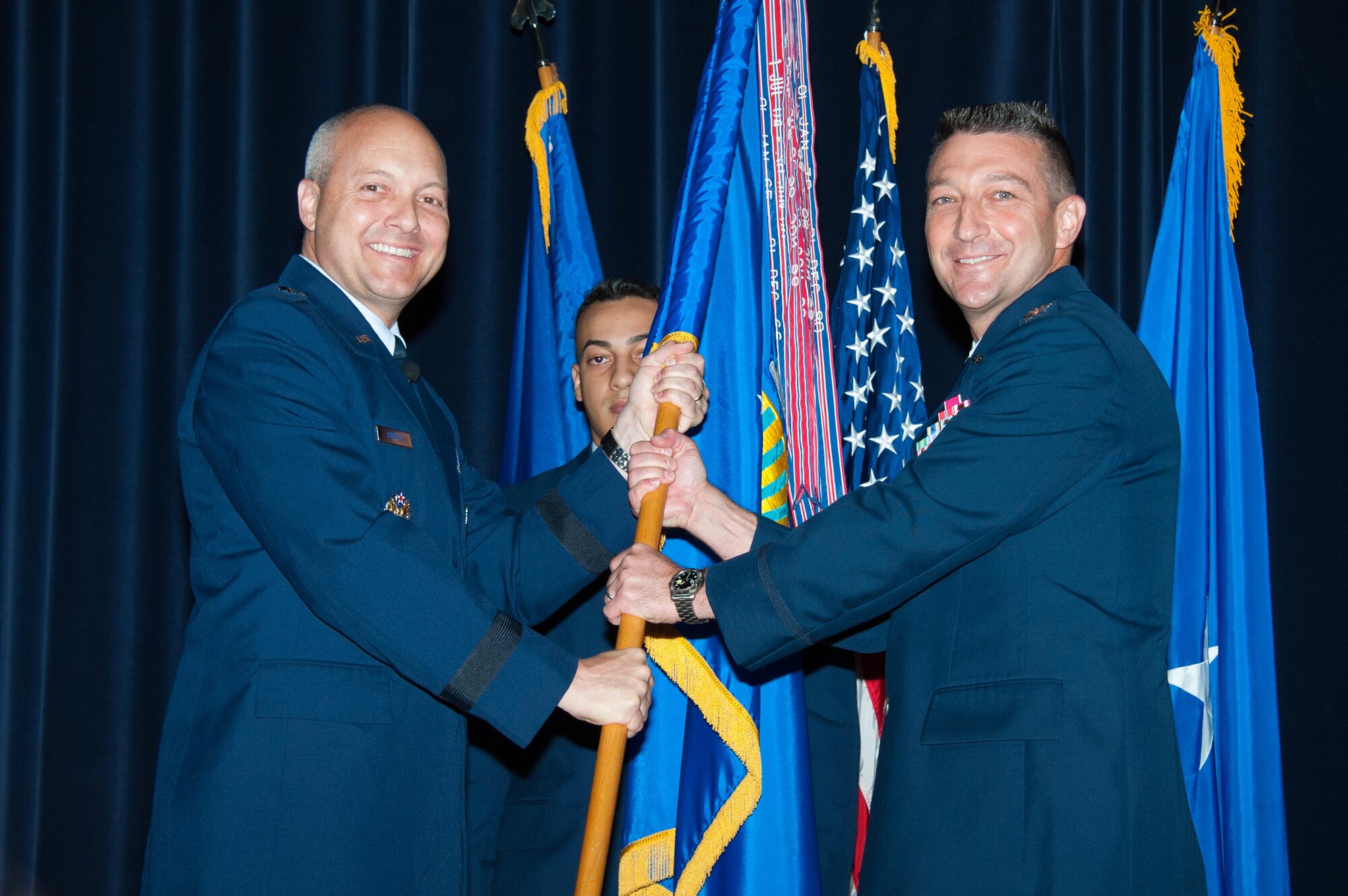 Col. Brian E. Hastings, right, assumes command of Air Command and Staff College from Brig. Gen. Christopher Coffelt, commander of Carl A. Spaatz Center for Officer Education and the Air War College, during a change of command ceremony  Aug. 3, 2015 at Maxwell Air Force Base. Hastings took command of the college from Col. William DeMarco. (U.S. Air Force photo by Melanie Rodgers Cox/Released)