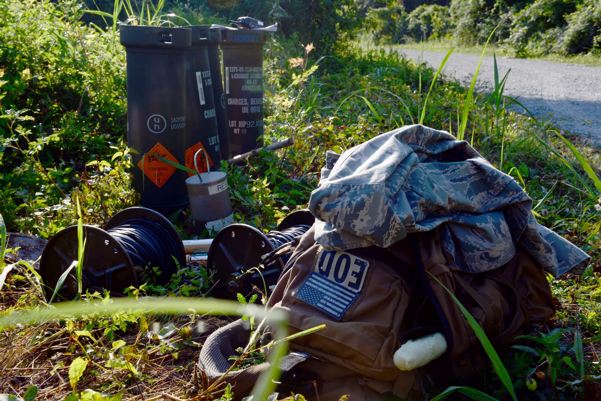 Explosive ordnance equipment is staged before being used in a controlled explosion as part of a de-watering project at Barksdale Air Force Base, La., July 29, 2015. The de-watering was implemented to keep wildlife from damaging base infrastructure. (U.S. Air Force Photo/Airman 1st Class Luke Hill)