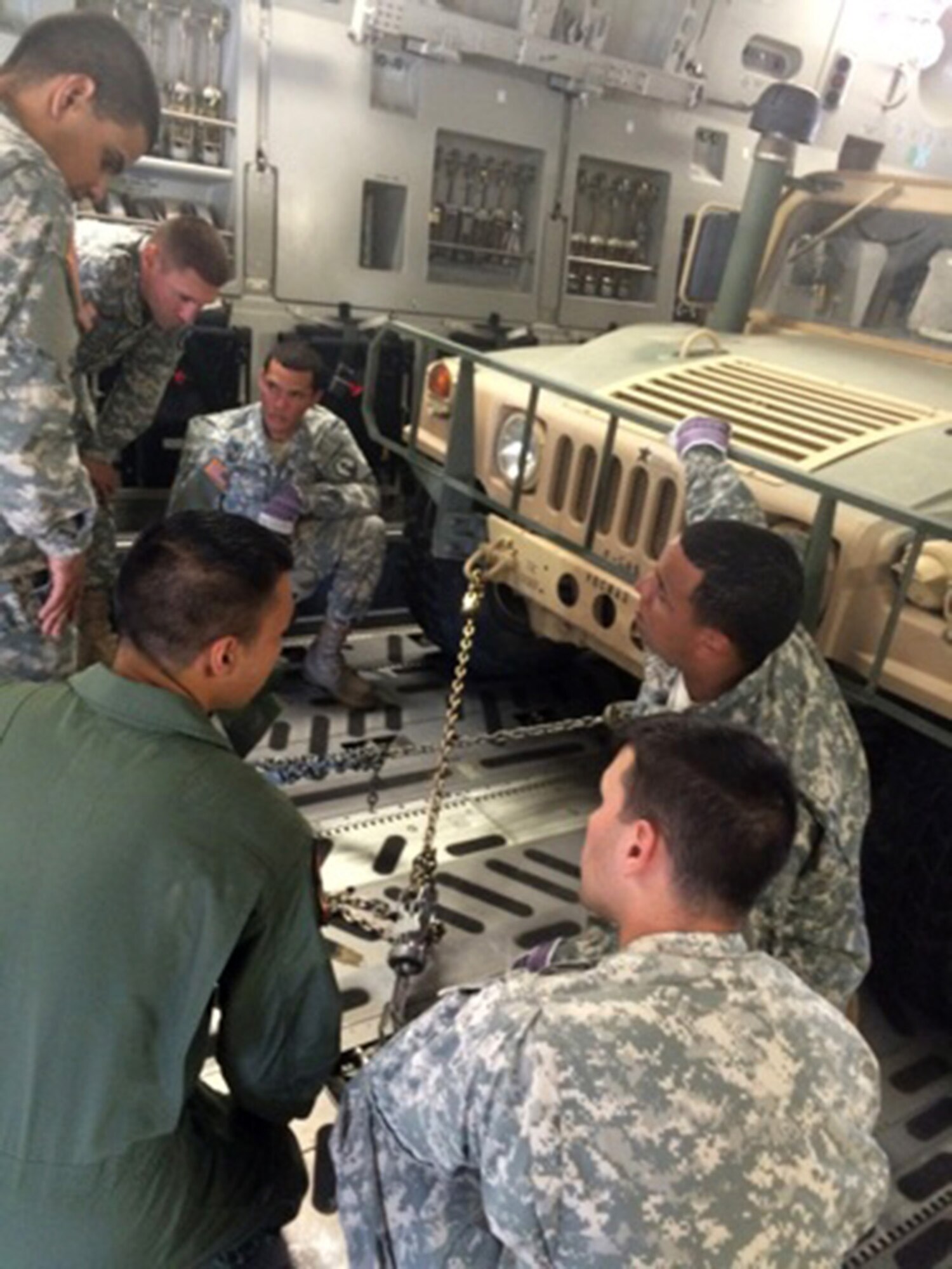 TRAVIS AIR FORCE BASE, Calif. -- Members from the 45th and 55th Aerial Port Squadrons, along with loadmasters from the 21st Airlift Squadron, took the unique opportunity to train here with the 390th Transportation Company, U.S. Army Reserve, Puerto Rico, July 31 - August 1. (courtesy photo)  