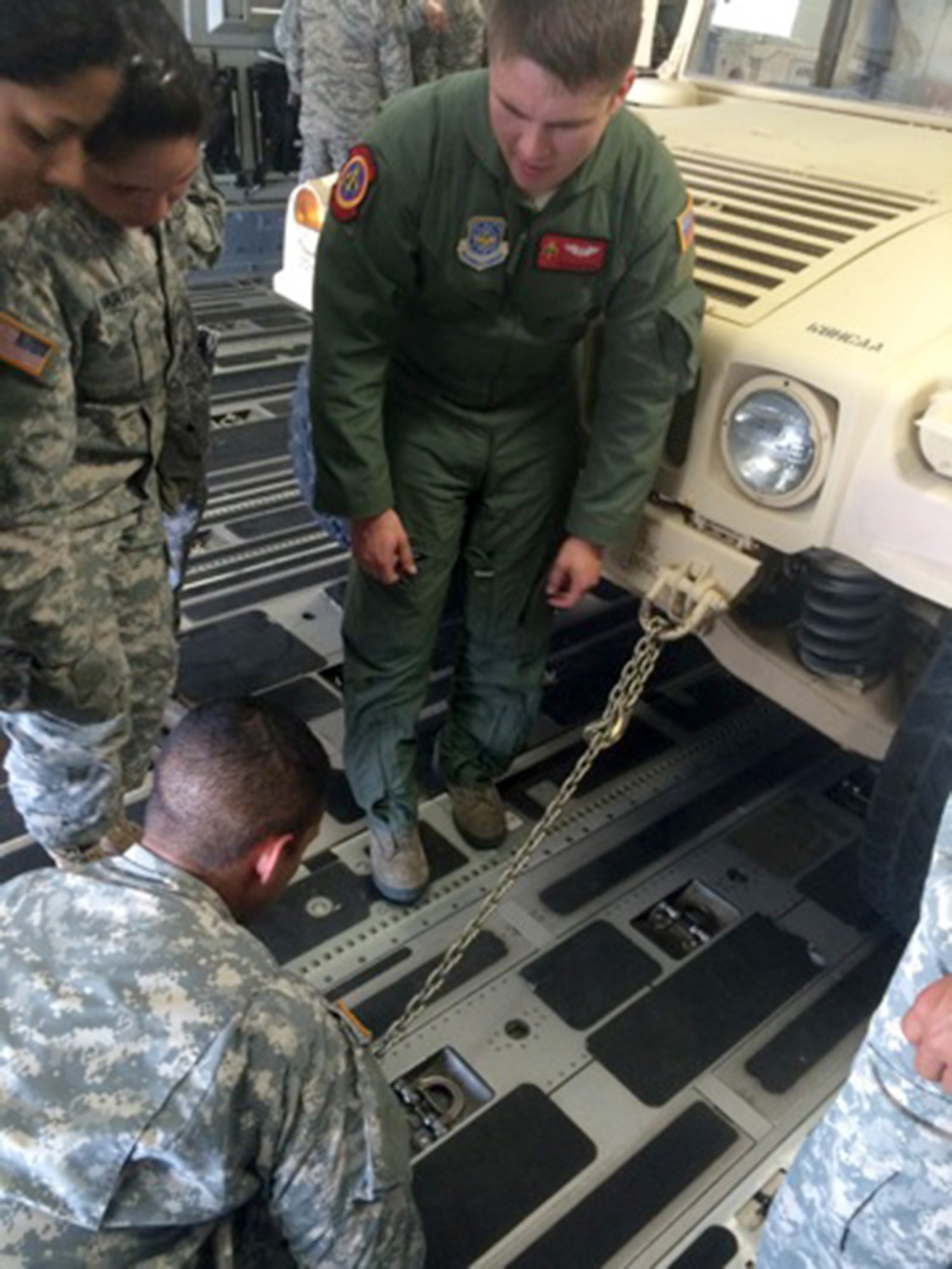 TRAVIS AIR FORCE BASE, Calif. -- Members from the 45th and 55th Aerial Port Squadrons, along with loadmasters from the 21st Airlift Squadron, took the unique opportunity to train here with the 390th Transportation Company, U.S. Army Reserve, Puerto Rico, July 31 - August 1. (courtesy photo)  