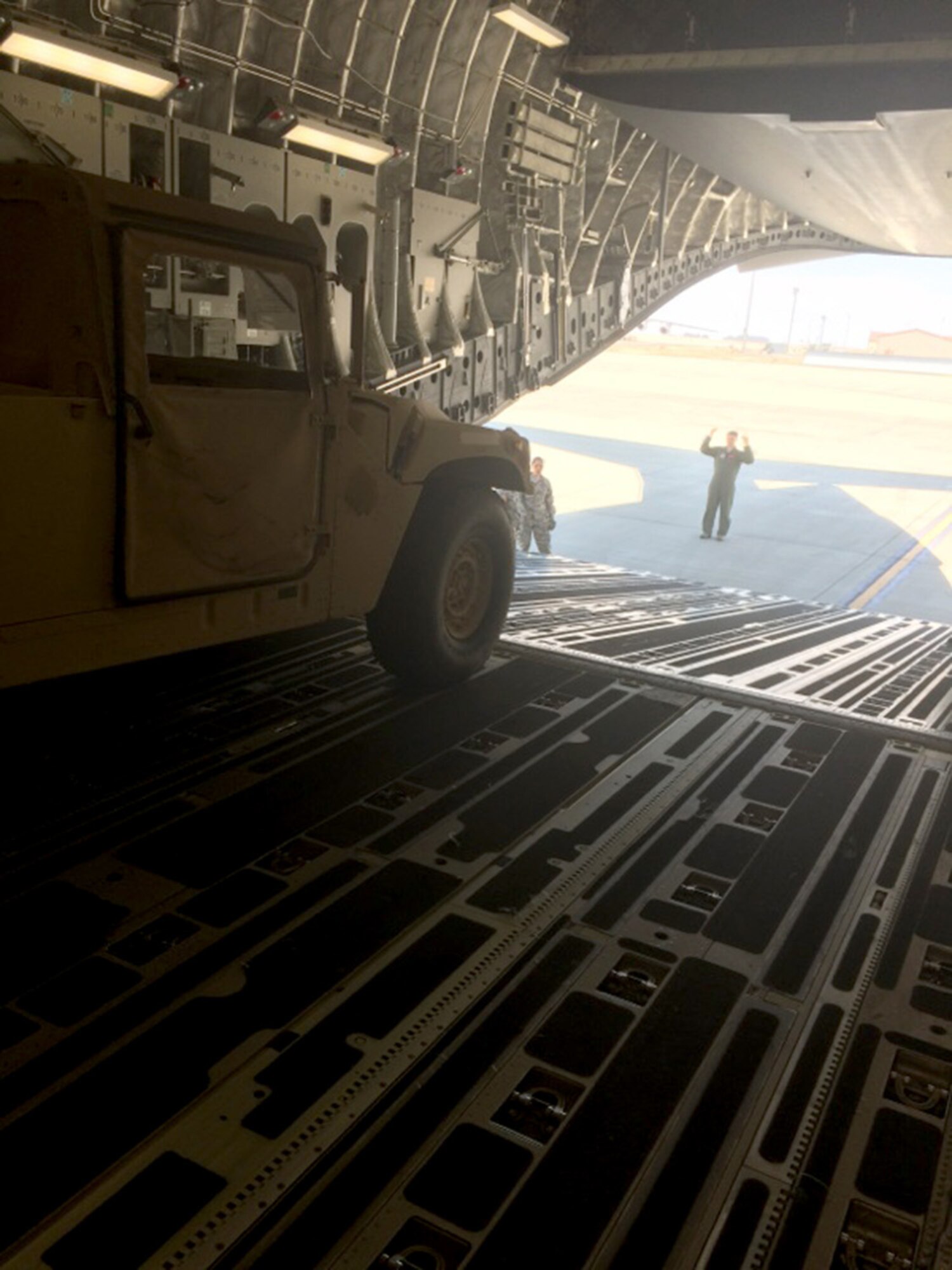 TRAVIS AIR FORCE BASE, Calif. -- Members from the 45th and 55th Aerial Port Squadrons, along with loadmasters from the 21st Airlift Squadron, took the unique opportunity to train here with the 390th Transportation Company, U.S. Army Reserve, Puerto Rico, July 31 - August 1. (courtesy photo)  