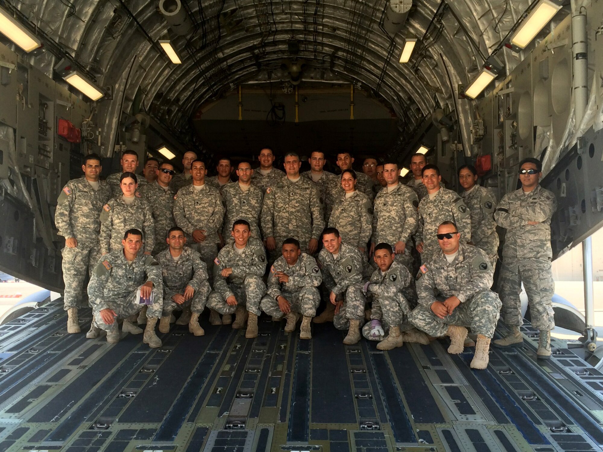 TRAVIS AIR FORCE BASE, Calif. -- Members from the 45th and 55th Aerial Port Squadrons, along with loadmasters from the 21st Airlift Squadron, took the unique opportunity to train here with the 390th Transportation Company, U.S. Army Reserve, Puerto Rico, July 31 - August 1. (courtesy photo)  