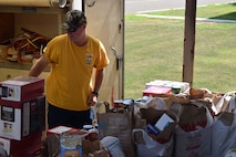 Scott Jensen with the Sons of the American Legion, Squadron 798 from Warminster, Pa. helps to unload two truckloads of food donations destine for the depleted shelves of the 111th Attack Wing’s Airman and Family Readiness Office’s food bank at the Horsham Air Guard Station, Horsham Pa., Aug. 2, 2015. The legion collected an estimated 3,000 pounds in just two days thanks to area companies, residents, passersby and the Upper Moreland Police Department. (U.S. Air National Guard photo by Master Sgt. Chris Botzum/Released)