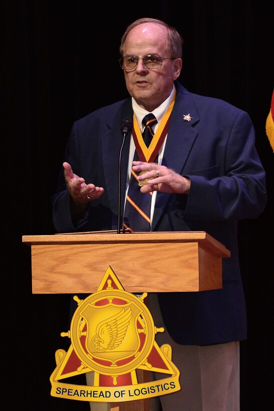 U.S. Army Retired Chief Warrant Officer 5 William Thomas, Transportation Corps Hall of Fame inductee, speaks to the crowd during an induction ceremony at Fort Eustis, Va., July 30, 2015. Thomas joined the U.S. Army Reserve in August 1960, serving during the Berlin Crisis before entering the active duty force in June 1976. (U.S. Air Force photo by Senior Airman Kimberly Nagle/Released)