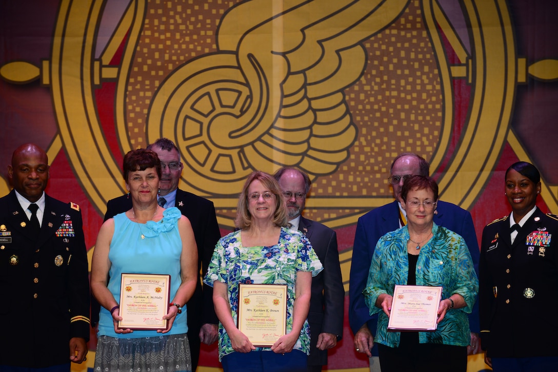 U.S. Army Transportation Corps Hall of Fame nominees and their wives pose for photos after being inducted at a Hall of Fame ceremony at Fort Eustis, Va., July 30, 2015. Each Hall of Fame inductee must have served as a member of the Transportation Corps and separated or retired from service for consideration. (U.S. Air Force photo by Senior Airman Kimberly Nagle/Released)