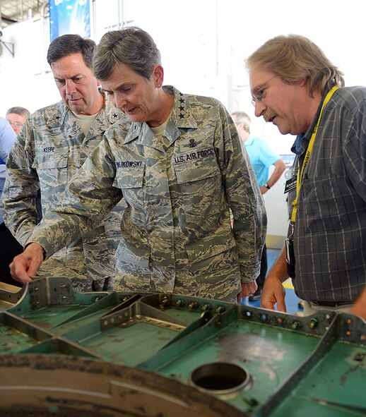 Richard Weeks, 561st Aircraft Maintenance Squadron F-15 flight chief, briefs Gen. Ellen M. Pawlikowski, Air Force Materiel Command commander, on positive production improvements realized by fully implementing the Air Force Sustainment Center's Art of the Possible at Robins Air Force Base, Ga., Aug. 4. Pawlikowski is on a three-day AFSC immersion at Robins, Tinker and Hill Air Force bases where units will show her the AFSC's scope and missions. (U.S. Air Force photo/Tommie Horton) 
