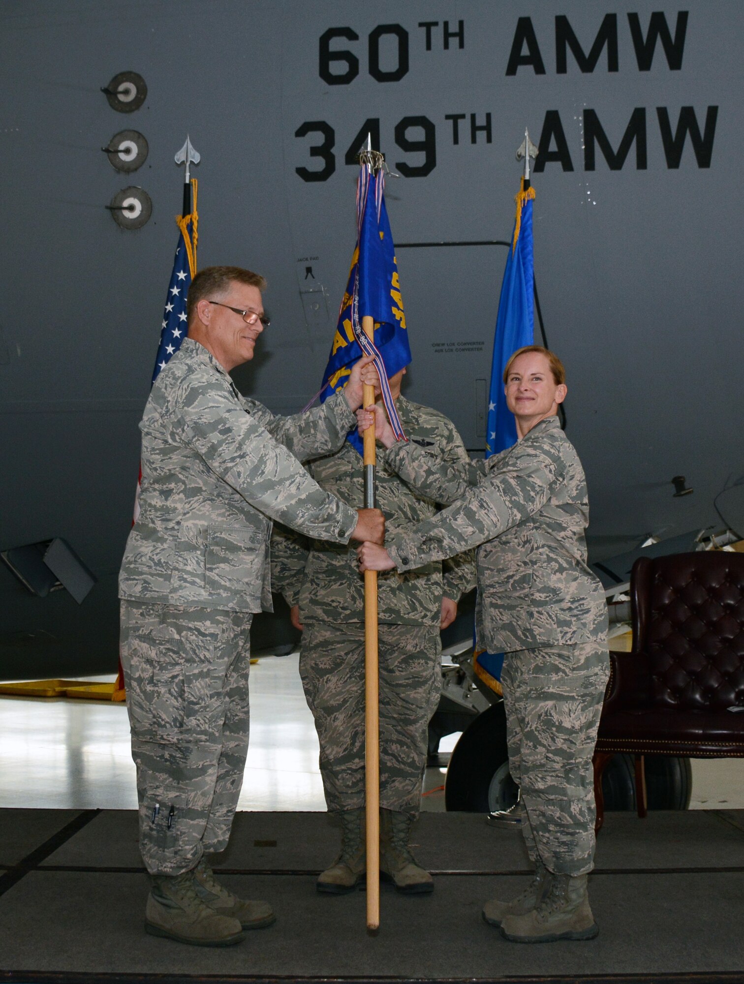 TRAVIS AIR FORCE BASE, Calif. -- Lt. Col. Joseph R. Orcutt relinquishes command of the 945th Aircraft Maintenance Squadron to Lt. Col. Arianne Mayberry, formerly the commander of the 349th Maintenance Operations Section, July 25, 2015 on Travis Air Force Base. (U.S. Air Force photos/Senior Airman Madelyn Brown)
