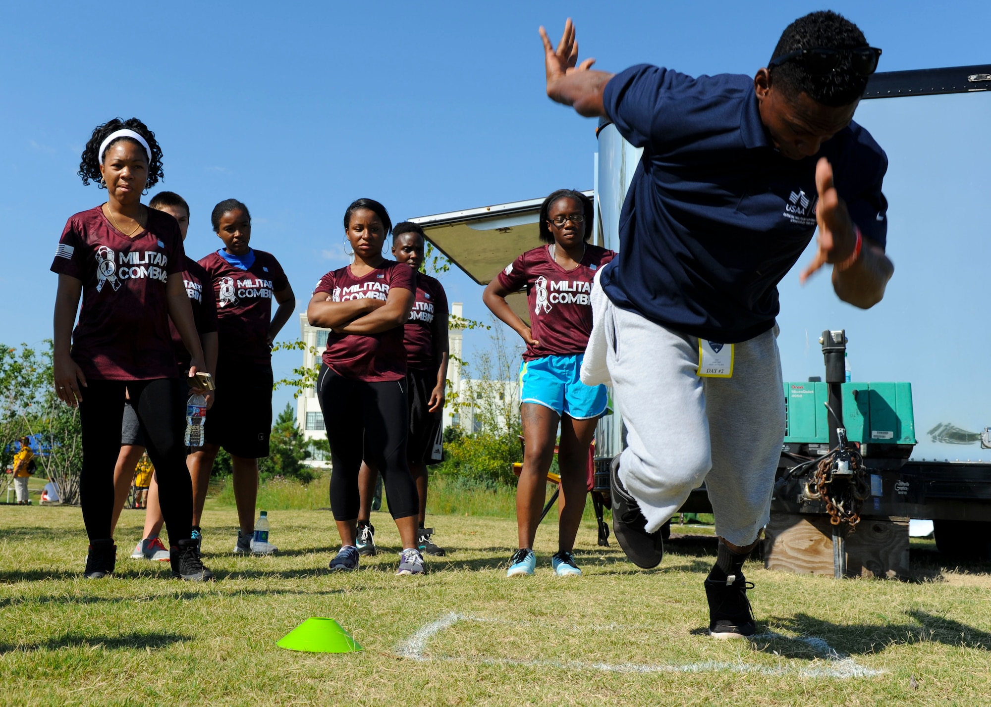 U.S. Service members analyze a proper 40 yard-dash starting technique during the USAA and Washington Redskins Military Combine at the Bon Secours Training Center in Richmond, Va., July 31, 2015. The fastest 40 yard-dash time of the day was 4.69 seconds.  (U.S. Air Force photo by Staff Sgt. John D. Strong II/Released)