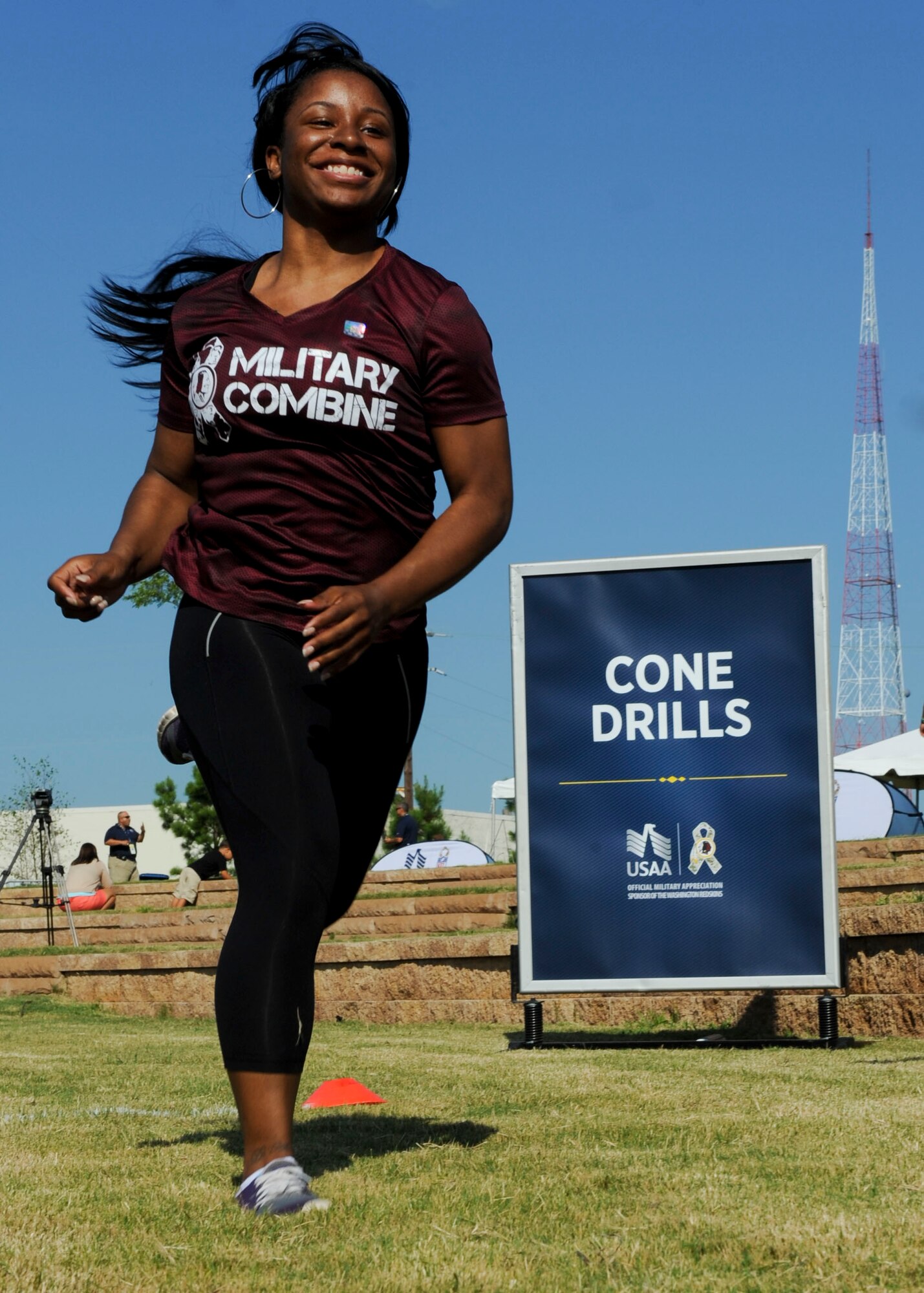 U.S. Army Spc. Danyale Davis, 567th Inland Cargo Transportation Company cargo specialist, performs the 20-yard shuttle cone drill during the USAA and Washington Redskins Military Combine at the Bon Secours Training Center in Richmond, Va., July 31, 2015. Davis was the runner-up in the female category of the combine. (U.S. Air Force photo by Staff Sgt. John D. Strong II/Released)