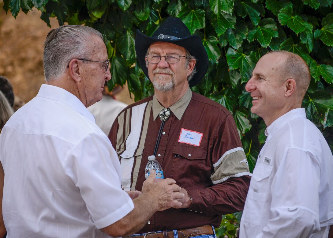 From right: Brig Gen Carl Schaefer, 412th Test Wing commander, talks with Civ-Mil members Bill Shelton and Rex Moen at the annual Edwards Air Force Base Civilian Military Support Group Barbecue July 30. (U.S. Air Force photo by Rebecca Amber)