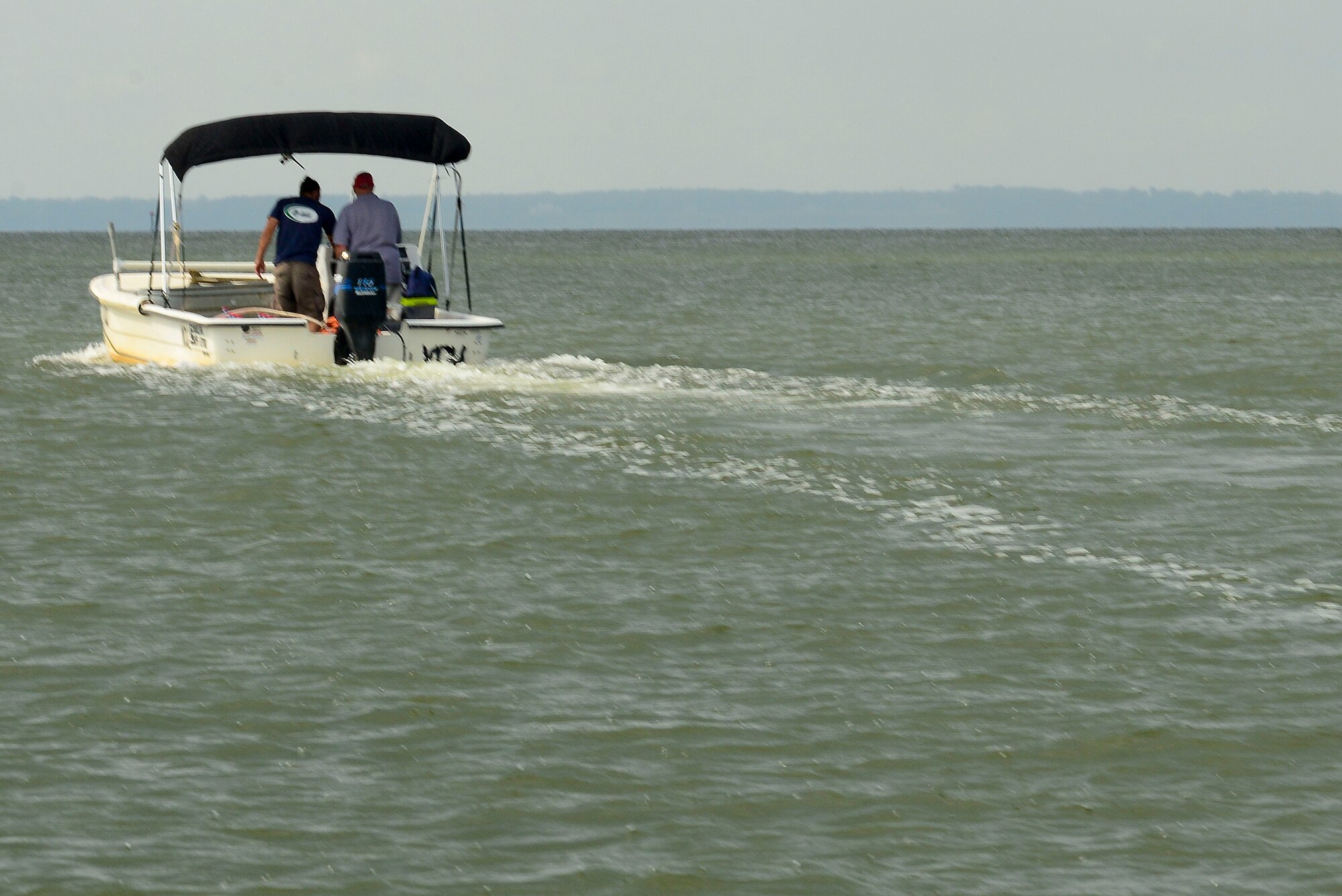 Virginia Commonwealth University Rice River Center researchers prepare to drop a gill net at Fort Eustis, Va., July 28, 2015. The team is searching for female sturgeons on the James River, in an effort to tag and track them later. (U.S. Air Force photo by Senior Airman Kimberly Nagle/Released)  