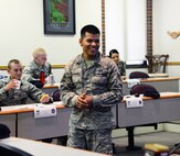 Staff Sgt. Guerddy Espinoza, First Term Airman Center NCO in charge, speaks to his last class, July 17, 2015, at Malmstrom Air Force Base, Mont. The NCOIC of FTAC manages the Airmen in the course and accepts responsibility for their accountability. (U.S. Air Force photo/Airman 1st Class Magen M. Reeves)