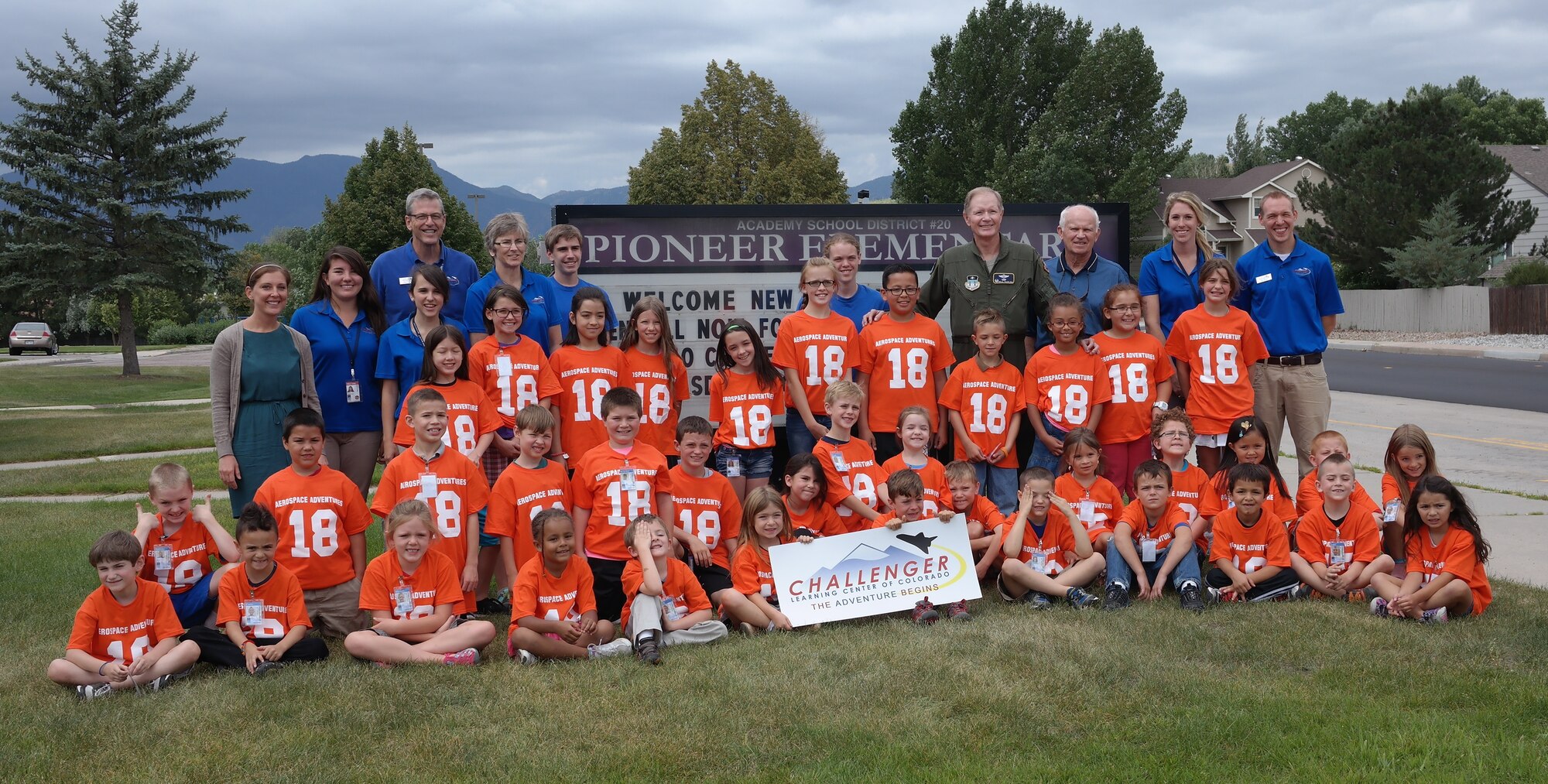 Col. Neil Barlow (center-right), head of the U.S. Air Force Academy's Aeronautics Department, stands with elementary school students and members of the Challenger Learning Center team July 28, 2015 at Pioneer Elementary School.  The group participated in the Aerospace Adventure Camp at the school July 27-31, 2015. (U.S. Air Force photo/Jennifer Green-Lanchoney)