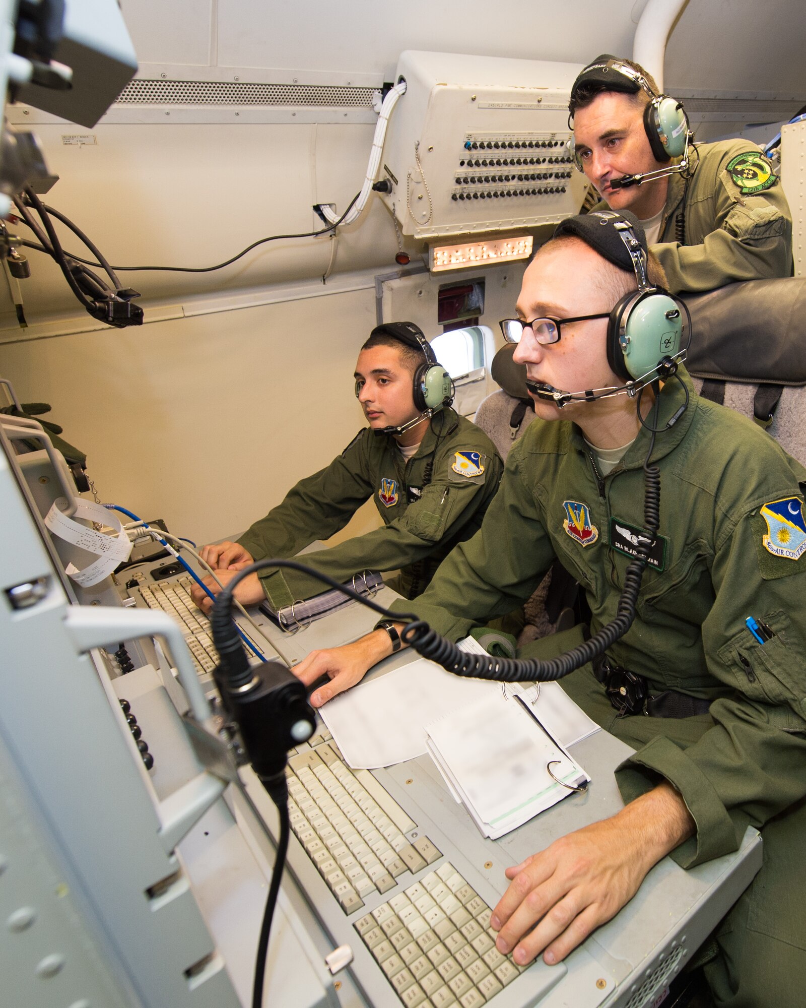 U.S. Airmen with the 12th Airborne Command and Control Squadron, perform pre-flight ops checks on an E-8C Joint STARS in preparation for a mission during the Northern Strike 2015 combat exercise, Robins Air Force Base, Ga., July 29, 2015. Team JSTARS joined military forces from more than 20 states and four coalition countries for the exercise hosted by the Michigan National Guard. Working with a liaison officer from the 116th Air Control Wing (ACW), Georgia Air National Guard, deployed to the exercise headquarters in Michigan, aircrews flying out of Robins Air Force Base from the 461st ACW and the Army JSTARS provided real-time tracking information to air and ground forces helping them to find and identify enemy forces played by exercise participants. (U.S. Air National Guard photo by Senior Master Sgt. Roger Parsons/Released) (Portions of the photo have been blurred for security purposes)