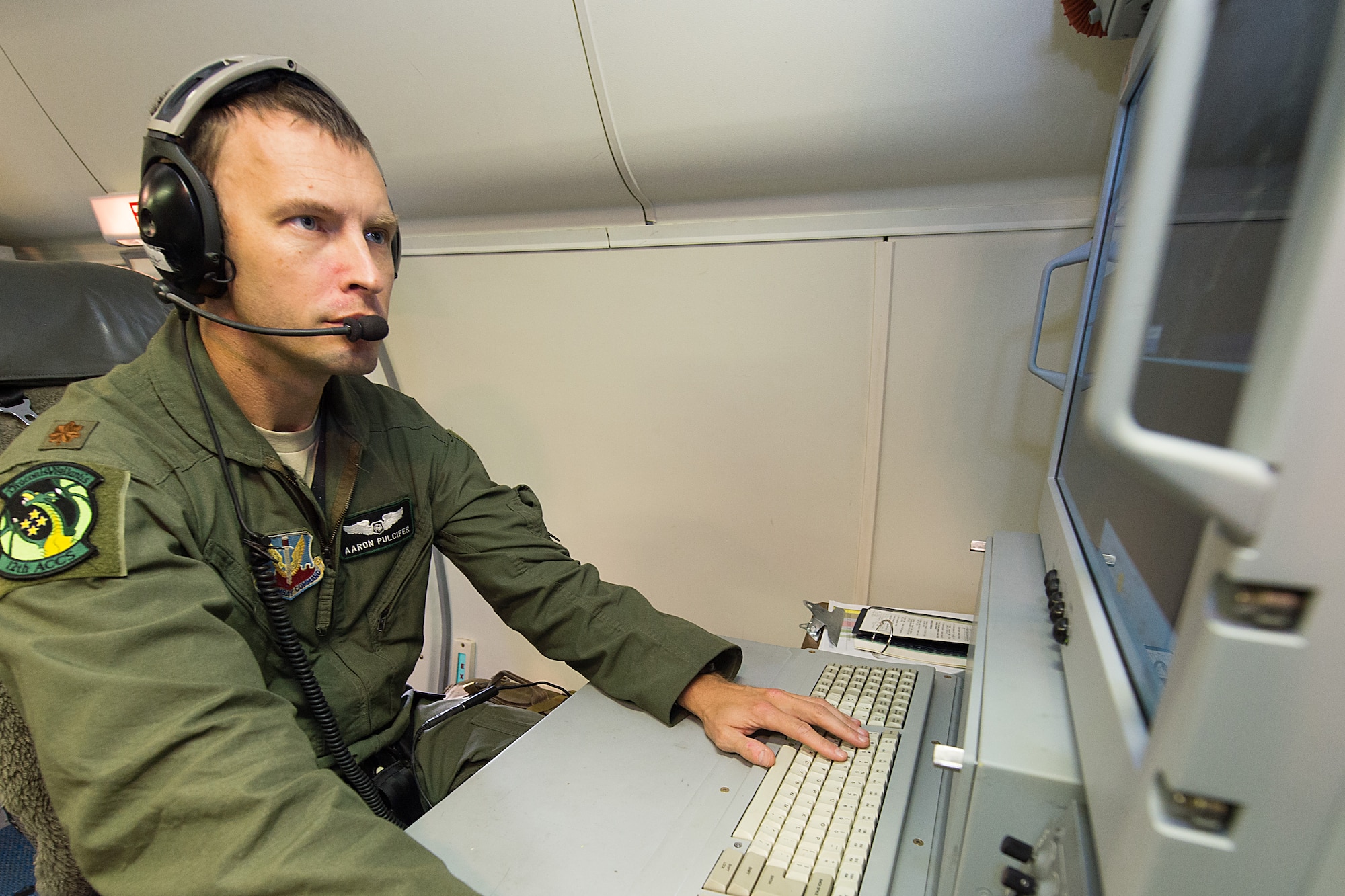 U.S. Air Force Maj. Aaron Pulcifer, a mission crew commander with the 12th Airborne Command and Control Squadron, performs a pre-flight ops check on an E-8C Joint STARS in preparation for a mission during the Northern Strike 2015 combat exercise, Robins Air Force Base, Ga., July 29, 2015. Team JSTARS joined military forces from more than 20 states and four coalition countries for the exercise hosted by the Michigan National Guard. Working with a liaison officer from the 116th Air Control Wing (ACW), Georgia Air National Guard, deployed to the exercise headquarters in Michigan, aircrews flying out of Robins Air Force Base from the 461st ACW and the Army JSTARS provided real- time tracking information to air and ground forces helping them to find and identify enemy forces played by exercise participants. (U.S. Air National Guard photo by Senior Master Sgt. Roger Parsons/Released)