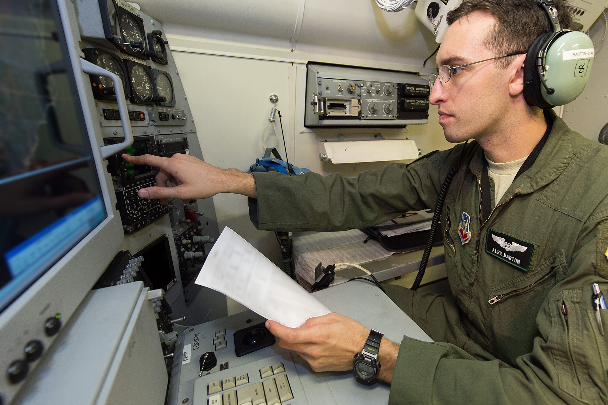 U.S. Air Force 1st Lt. Alex Barton, a navigator with the 12th Airborne Command and Control Squadron, performs a pre-flight ops check on an E-8C Joint STARS in preparation for a mission during the Northern Strike 2015 combat exercise, Robins Air Force Base, Ga., July 29, 2015. Team JSTARS joined military forces from more than 20 states and four coalition countries for the exercise hosted by the Michigan National Guard. Working with a liaison officer from the 116th Air Control Wing (ACW), Georgia Air National Guard, deployed to the exercise headquarters in Michigan, aircrews flying out of Robins Air Force Base from the 461st ACW and the Army JSTARS provided real-time tracking information to air and ground forces helping them to find and identify enemy forces played by exercise participants. (U.S. Air National Guard photo by Senior Master Sgt. Roger Parsons/Released) (Portions of the photo have been blurred for security purposes)