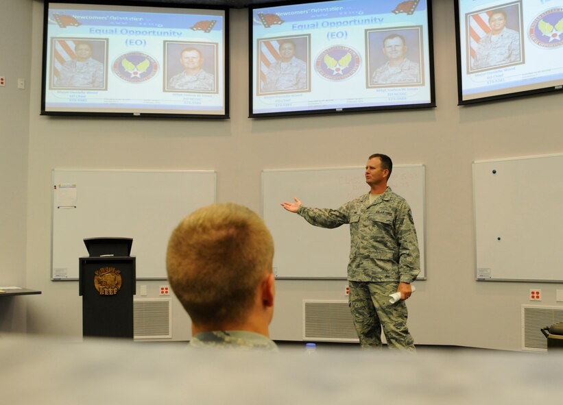 Master Sgt. Josh Jones briefs Airmen on equal opportunity Aug. 1, 2015, during a newcomers briefing at Ebbing Air National Guard Base, Fort Smith, Ark. Equal opportunity is a program to assist in creating a positive working environment within the Air National Guard. Jones is the 188th Wing Equal Opportunity noncommissioned officer in charge. (U.S. Air National Guard photo by Staff Sgt. Hannah Dickerson/Released)