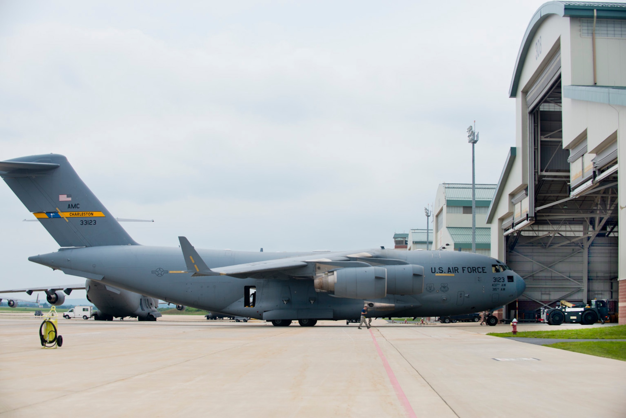 The final C-17 Globemaster III aircraft to be assigned to the 167th Airlift Wing is towed
into the corrosion control hangar just after arriving at the Martinsburg, W.Va. air base, July
17. The aircraft was previously flown by airlift wings assigned to Charleston Air Force
Base. To finalize the transfer of the aircraft to the 167th Airlift Wing, the C-17 underwent
numerous inspections, paperwork updates and the tail flash and unit marking were
repainted. (Air National Guard photo by Master Sgt. Emily Beightol-Deyerle/released)