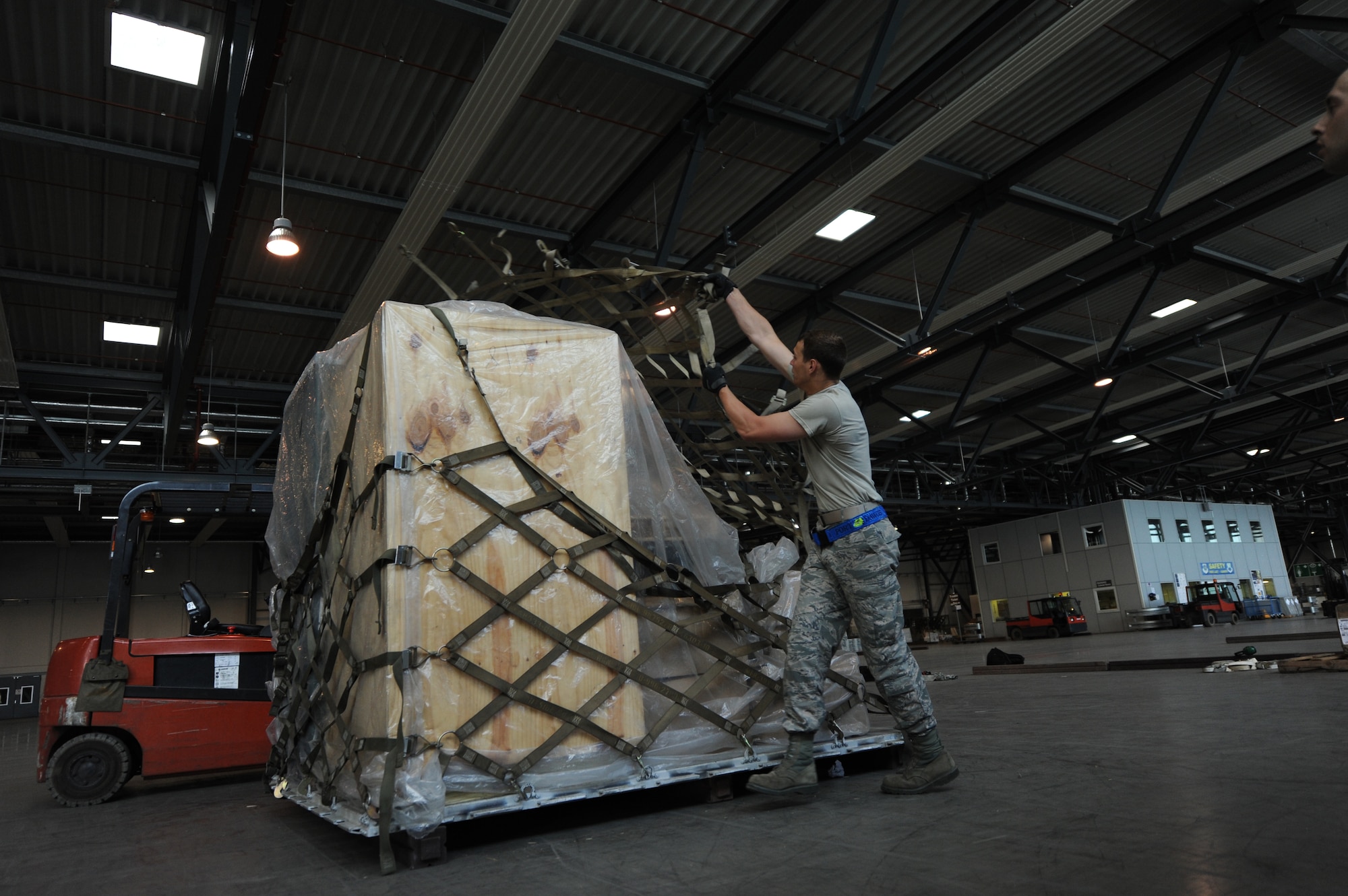 Airman 1st Class Jakob Nance, 435th Contingency Response Group mobile aerial porter, participates in the cargo pallet buildup portion of the 2015 Ramstein Air Base Rodeo Aug. 1, 2015, at Ramstein Air Base, Germany. The event is a competition aimed at showcasing the skills of the air transportation career field. The 435th CRG team placed first in the obstacle course event. (U.S. Air Force photo/Staff Sgt. Sharida Jackson)