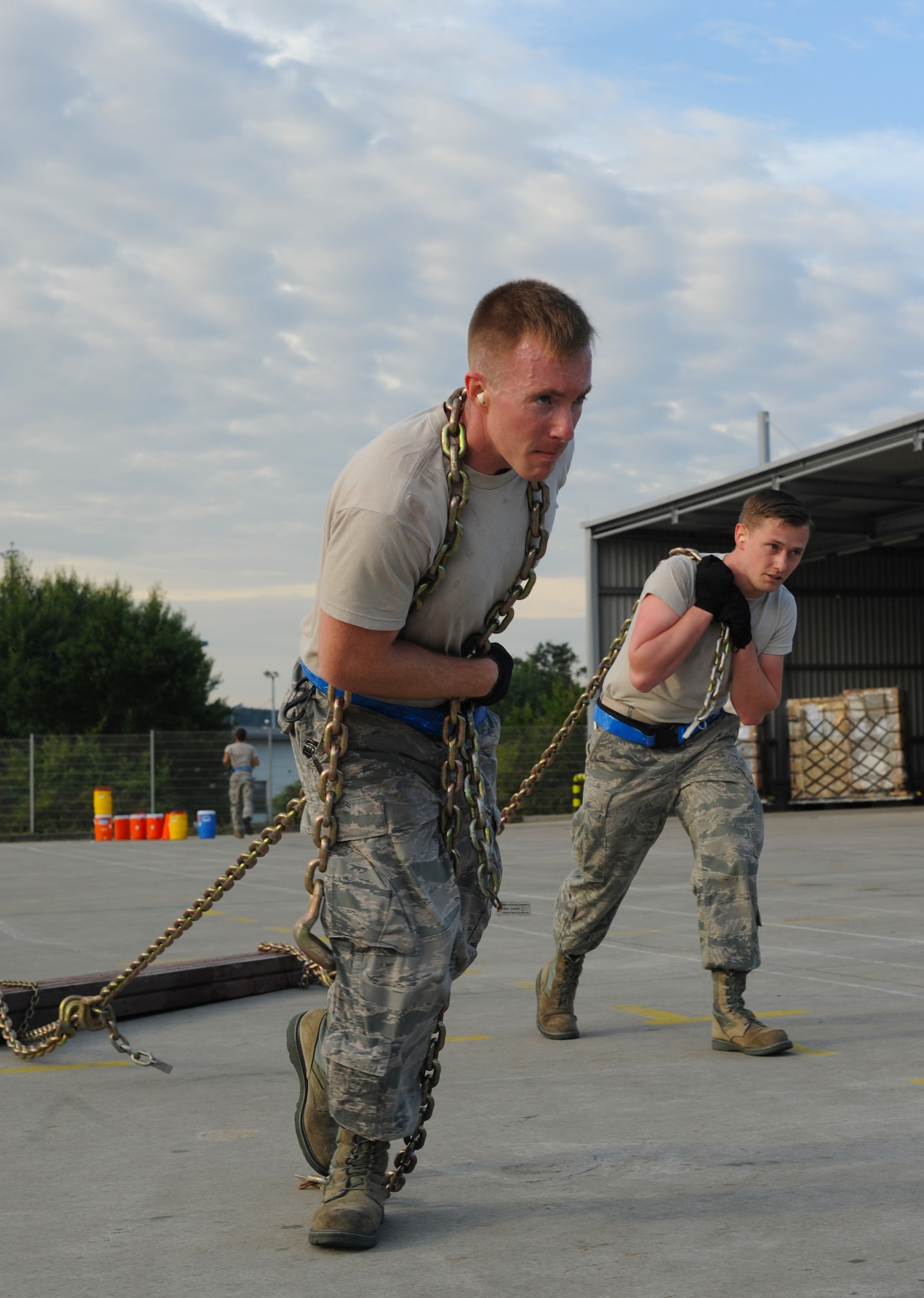 Senior Airman Daniel Hall, left, and Senior Airman Travis Barrett, both 721st Aerial Port Squadron passenger service specialists, participate in the obstacle course portion of the 2015 Ramstein Air Base Rodeo Aug. 1, 2015, at Ramstein Air Base, Germany.  The event is a competition aimed at showcasing the skills of the air transportation career field. The 721st APS passenger services team placed first in the knowledge test portion of the event.  (U.S. Air Force photo/Staff Sgt. Sharida Jackson)