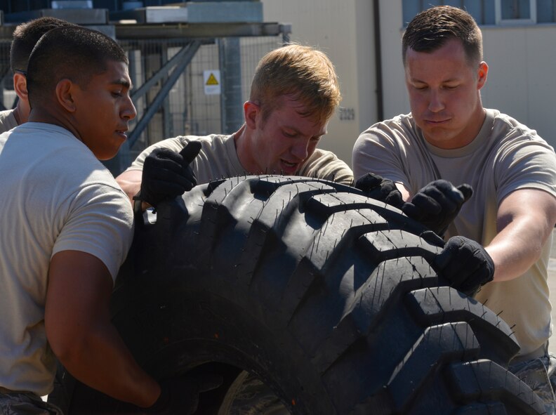 Airmen from the 721st Aerial Port Squadron participate in the obstacle course portion of the 2015 Ramstein Air Base Rodeo Aug. 1, 2015, at Ramstein Air Base, Germany. Approximately 100 people within the air transportation career field participated in the skills competition. The 721st APS ramp services team placed first overall in the rodeo. (U.S. Air Force photo/Staff Sgt. Sharida Jackson)