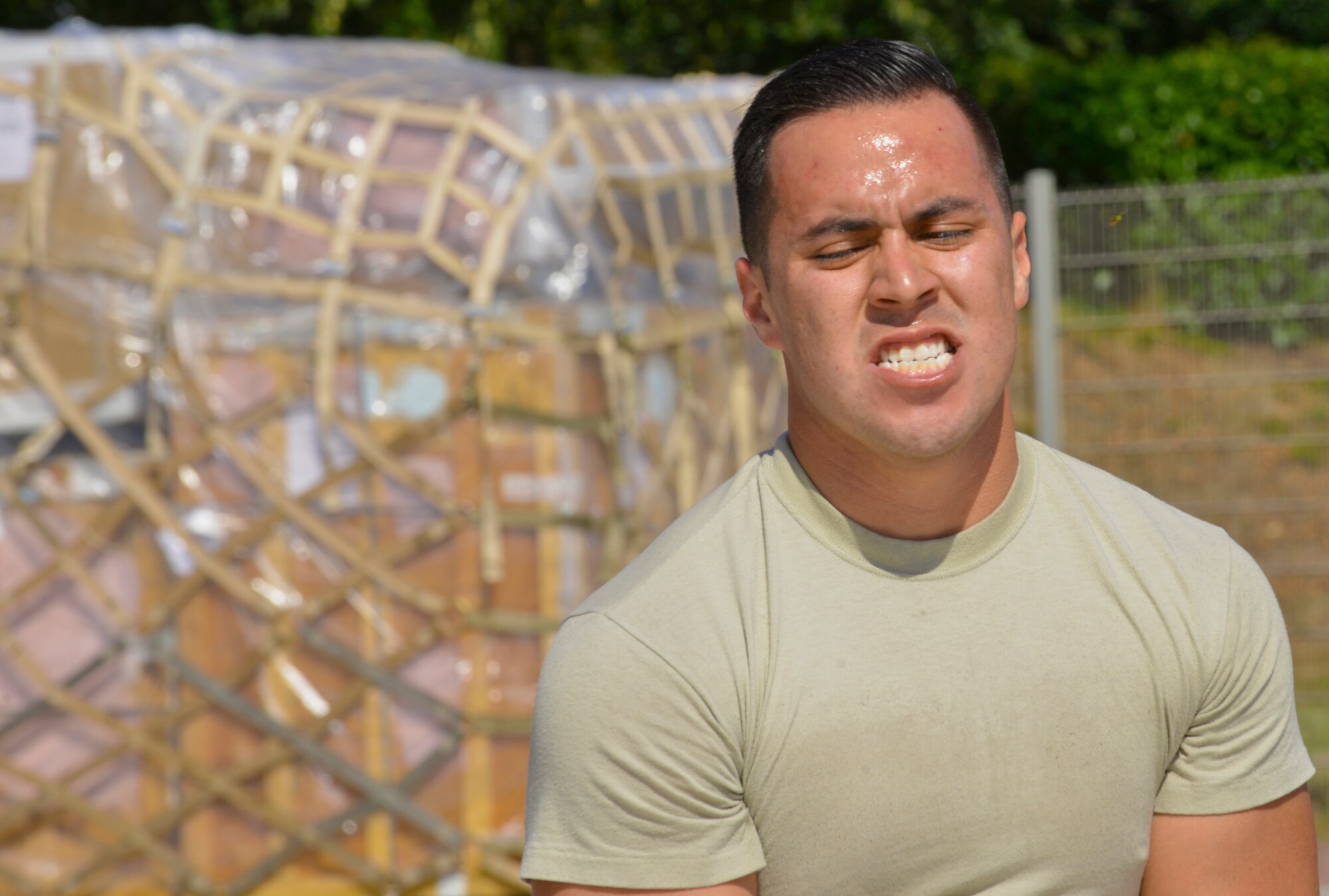 Senior Airman Arturo Anchondo, 721st Aerial Port Squadron ramp services specialist, participates in the obstacle course portion of the 2015 Ramstein Air Base Rodeo Aug. 1, 2015, at Ramstein Air Base, Germany. Approximately 100 people within the air transportations career field participated in the skills competition. The 721st APS ramp services team placed first overall in the rodeo. (U.S. Air Force photo/Staff Sgt. Sharida Jackson)