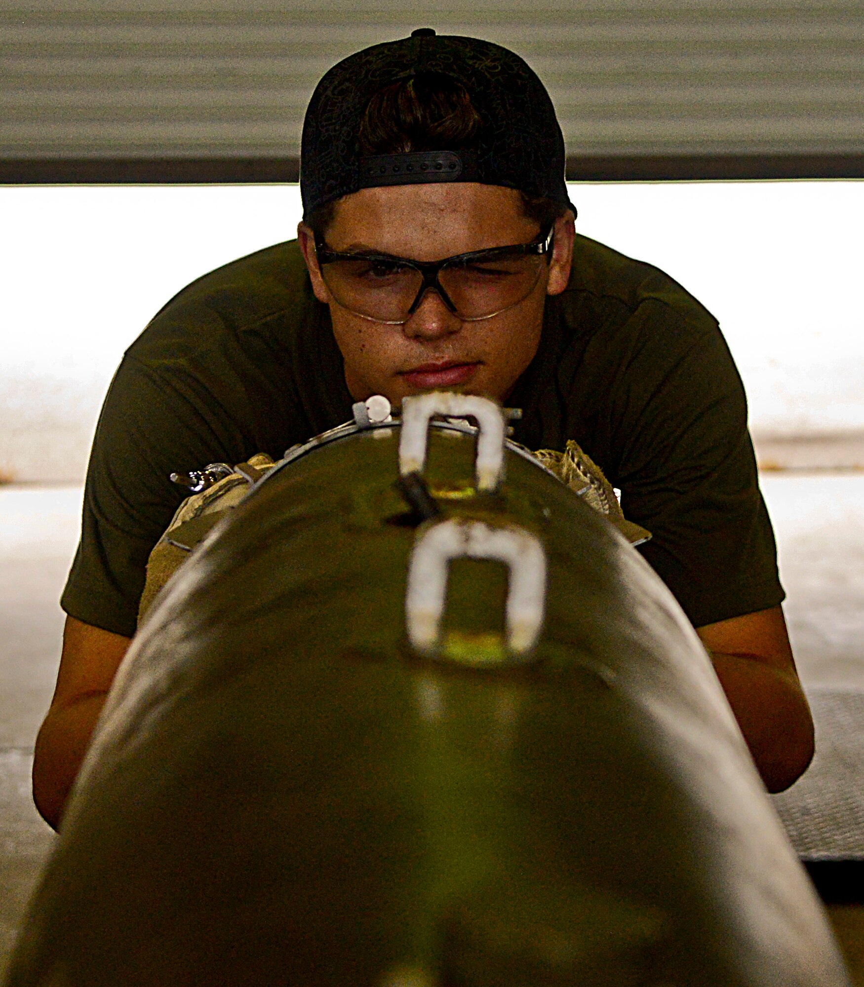 Cade Liddell, son of retired American mixed martial artist Chuck “The Iceman” Liddell, checks a guided bomb unit-38 on Osan Air Base, South Korea, Aug. 5, 2015. Airmen from the 51st Munitions Squadron assisted Cade. He expressed his interest in the munitions field and said he hopes to join the Air Force in the future.  (U.S. Air Force photo/Senior Airman Kristin High)