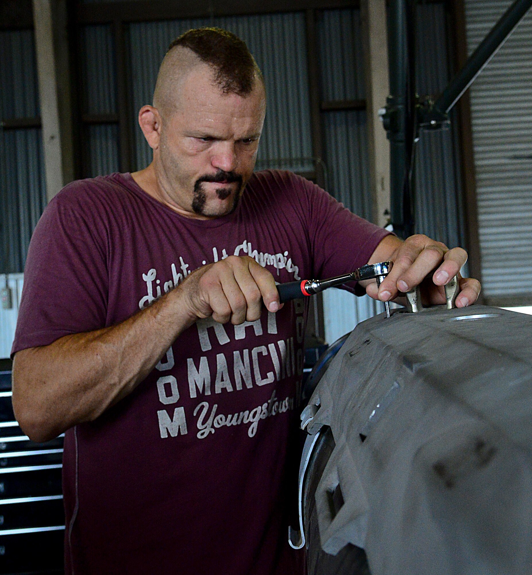 Chuck “The Iceman” Liddell, retired American mixed martial artist, tightens a bolt on a guided bomb unit-31 on Osan Air Base, South Korea, Aug. 5, 2015. Liddell visited various units across the base during a morale trip. Liddell is a former Ultimate Fighting Championship Light Heavyweight Champion. He has an extensive striking background in Kempo, Koei-Kan karate, and kickboxing, as well as a grappling background in collegiate wrestling and Brazilian Jiu-Jitsu. (U.S. Air Force photo/Senior Airman Kristin High)