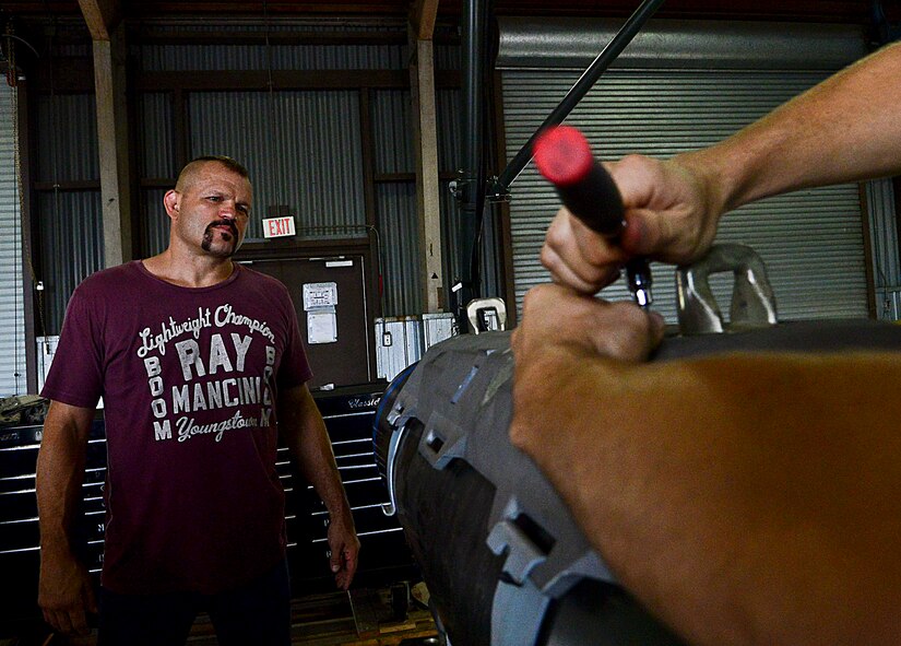 Chuck “The Iceman” Liddell, retired American mixed martial artist, observes an Airman tightening a bolt on a guided bomb unit-31 on Osan Air Base, South Korea, Aug. 5, 2015. Liddell and his family visited various units on base, learning the importance of Team Osan’s mission in helping guard South Korea and the freedom of 51 million people. (U.S. Air Force photo/Senior Airman Kristin High)
