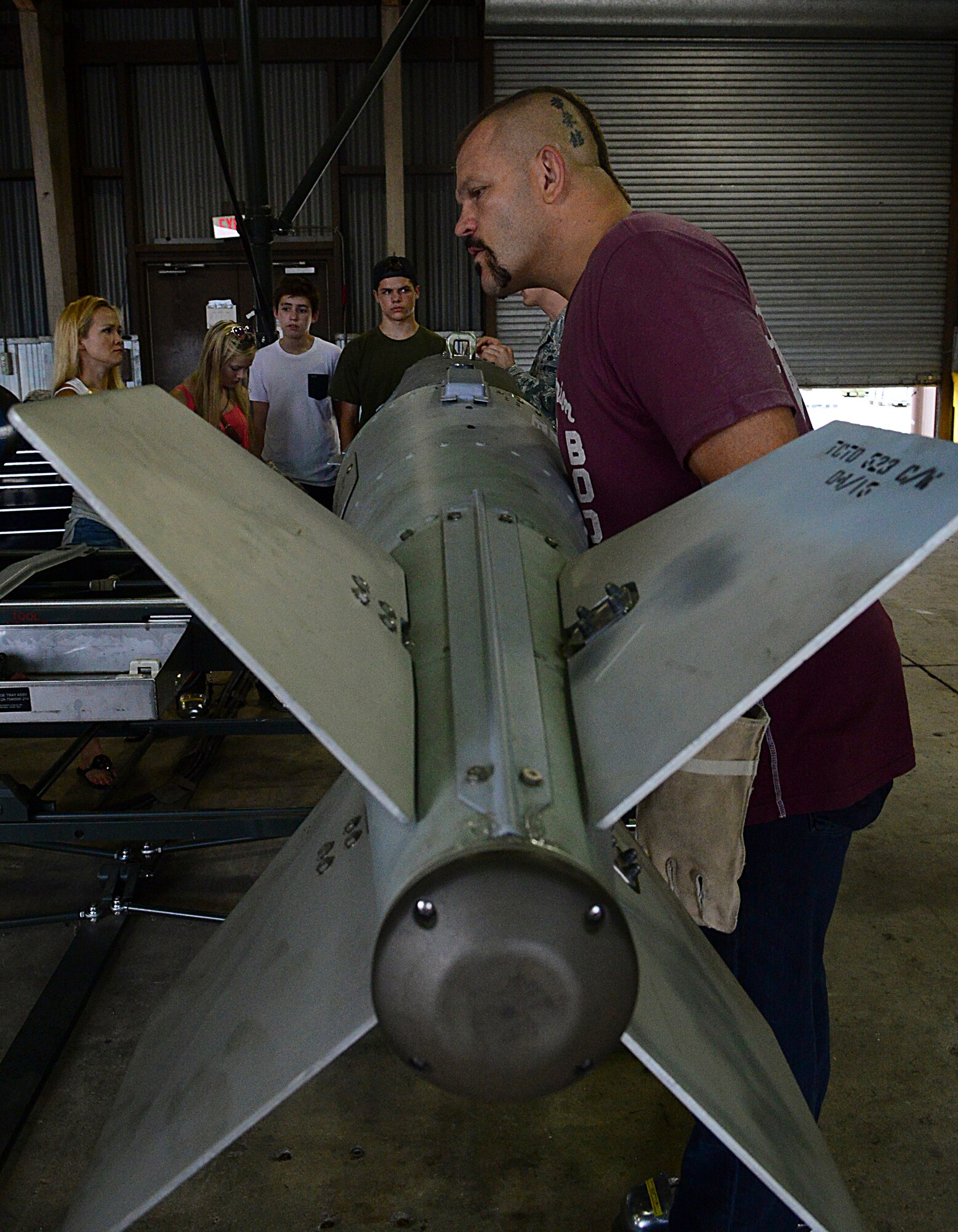 Chuck “The Iceman” Liddell, retired American mixed martial artist, inspects a guided bomb unit-31 on Osan Air Base, South Korea, Aug. 5, 2015. Liddell is a former Ultimate Fighting Championship Light Heavyweight Champion. He has an extensive striking background in Kempo, Koei-Kan karate, and kickboxing, as well as a grappling background in collegiate wrestling and Brazilian Jiu-Jitsu. (U.S. Air Force photo/ Senior Airman Kristin High)