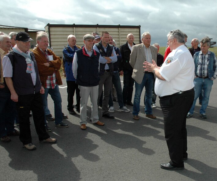 Philipp Recktenwald, a German fire inspector, welcomes the Freundeskreis der Luftwaffe e.V. Association and gives an overview of the base fire department during the association’s visit at Spangdahlem Air Base, Germany, July 13, 2015. The tour included sections of the 726th Air Mobility Squadron as well as sites from the 52nd Fighter Wing. (U.S. Air Force photo by Iris Reiff/Released)  