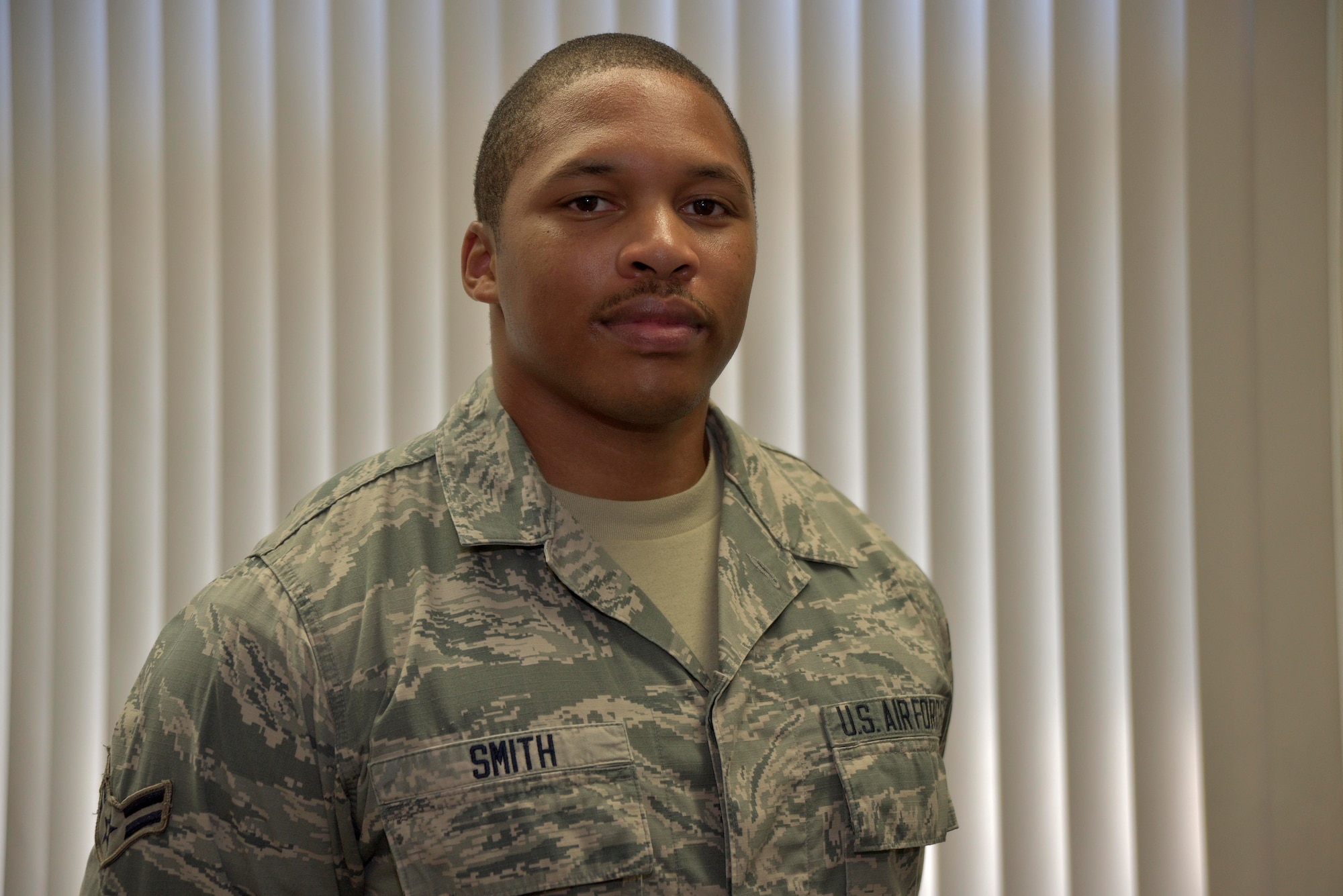 U.S. Air Force Airman 1st Class Spencer Smith, 35th Force Support Squadron installation personnel readiness journeyman, was selected as the 35th Fighter Wing wild weasel of the week at Misawa Air Base, Japan, August 5, 2015. Smith’s duties include processing and accounting for personnel deployed to Misawa, and accounting and monitoring the status of personnel and their families affected by a wide-spread catastrophic event via the Air Force Personnel Accountability and Assessment System. (U.S. Air Force photo by Senior Airman Jose L. Hernandez-Domitilo)