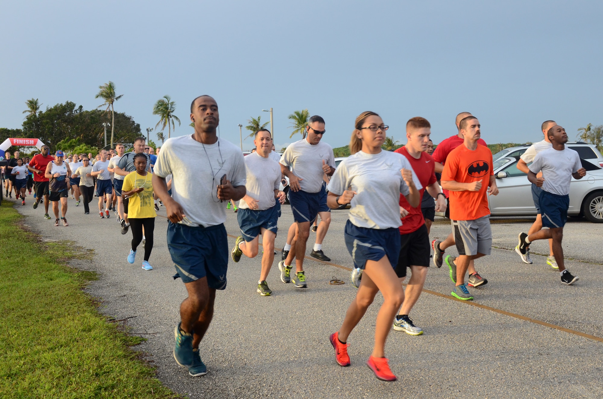 Runners take off during the Superhero Scramble 5K run Aug. 5, 2015, at Andersen Air Force Base, Guam. Some participants donned their superhero outfits while others wore their favorite superhero T-shirt. (U.S. Air Force photo by Airman 1st Class Alexa Ann Henderson/Released)