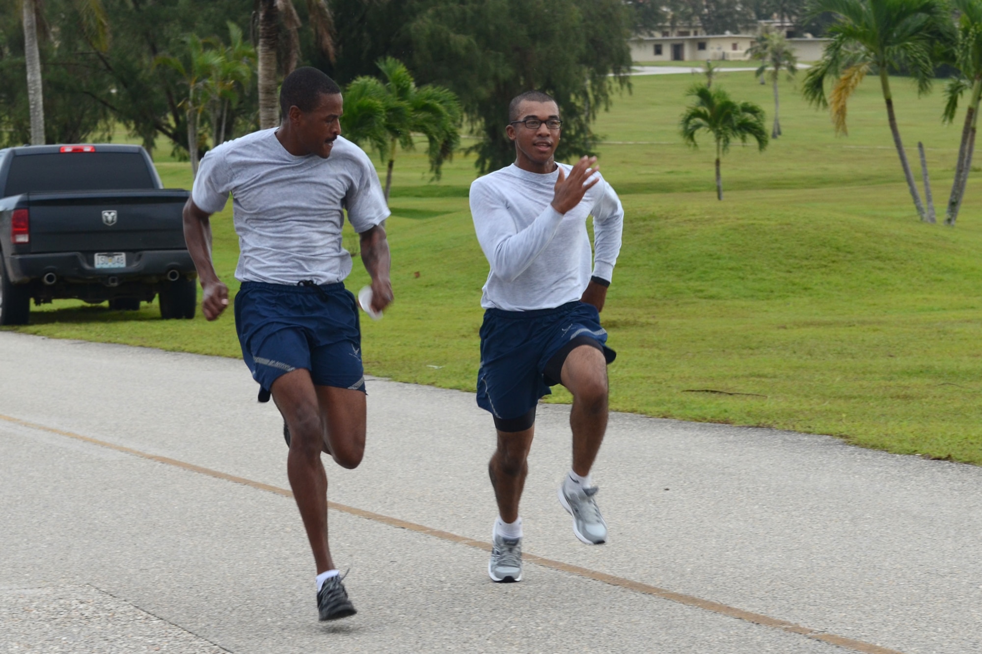Airmen race to the finish at the Superhero Scramble 5K run Aug. 5, 2015, at Andersen Air Force Base, Guam. Some participants donned their superhero outfits while others wore their favorite superhero T-shirt. (U.S. Air Force photo by Airman 1st Class Alexa Ann Henderson/Released)