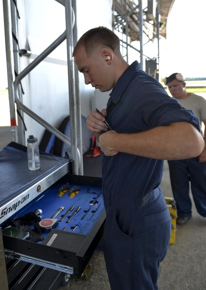Airman 1st Class Zachary Weeks, 33rd Aircraft Maintenance Squadron crew chief, stores his tools in an Aerospace propulsion general maxi at Eglin Air Force Base, Fla., August 4, 2015. Week’s responsibility on the flight line is to safely inspect and launch the F-35A Lighting II. (U.S. Air Force Photo/Senior Airman Andrea Posey)