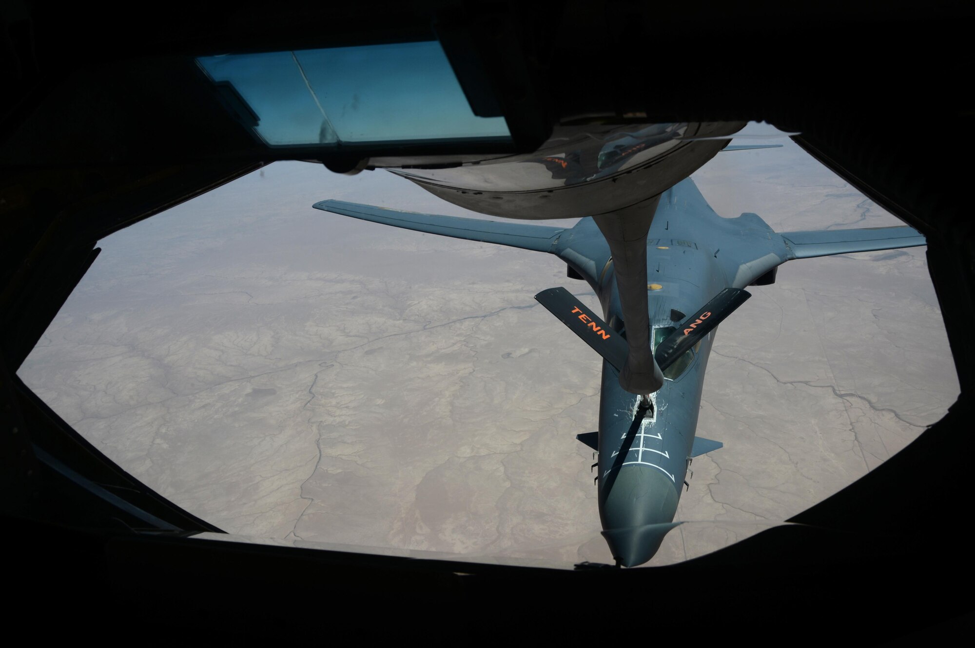A U.S. Air Force KC-135 Stratotanker from the 340th Expeditionary Air Refueling Squadron refuels a USAF B-1B Lancer from the 34th Expeditionary Bomb Squadron over Southwest Asia in support of Operation Inherent Resolve, July 23, 2015. OIR is the military intervention against Daesh. (U.S. Air Force photo by Staff Sgt. Sandra Welch)