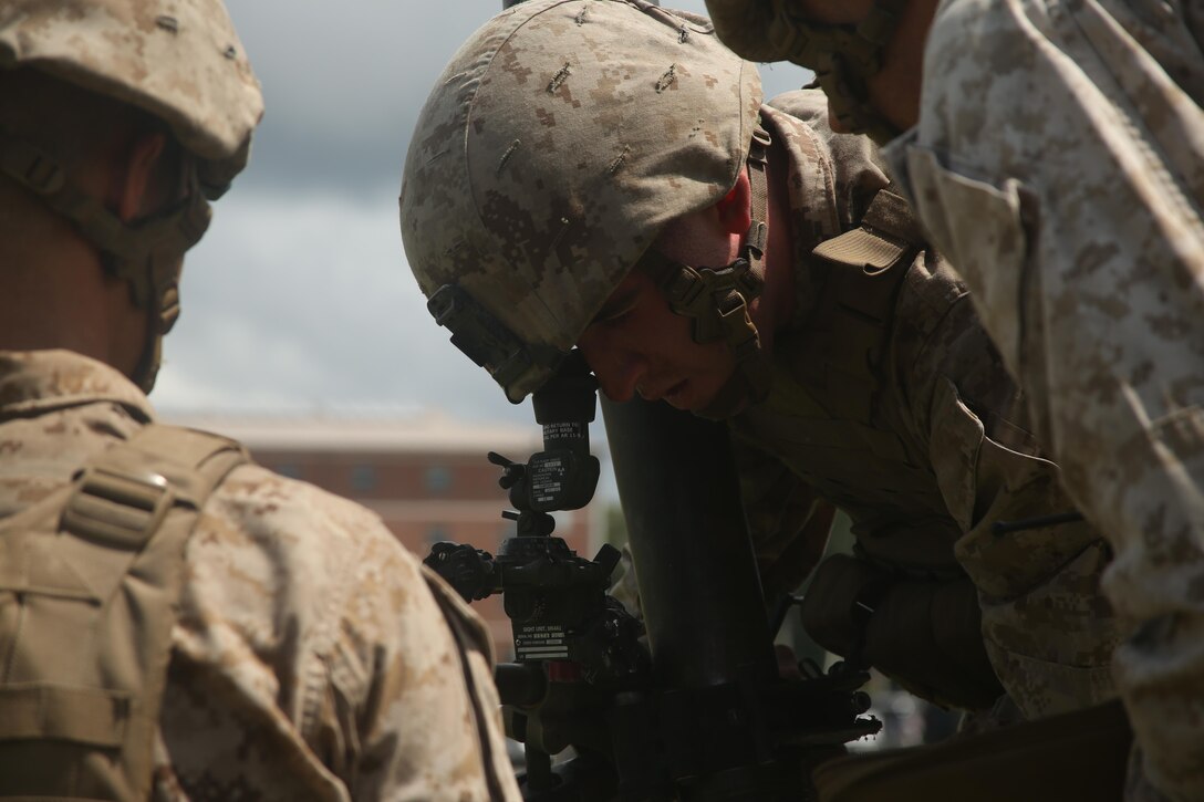 A Marine with 1st Battalion, 8th Marine Regiment, 2nd Marine Division, checks the line of sight on an 81mm Mortar during a training exercise aboard Camp Lejeune, N.C. July 30, 2015. Marines with the unit conducted “hip shoots” to better prepare them on the go. A “hip shoot” is where mortar teams receive a call for fire on the move and use their leadership and teamwork to set-up the mortars and begin supporting the unit. (U.S. Marine Corps photo by Lance Cpl. Dalton Precht/released)