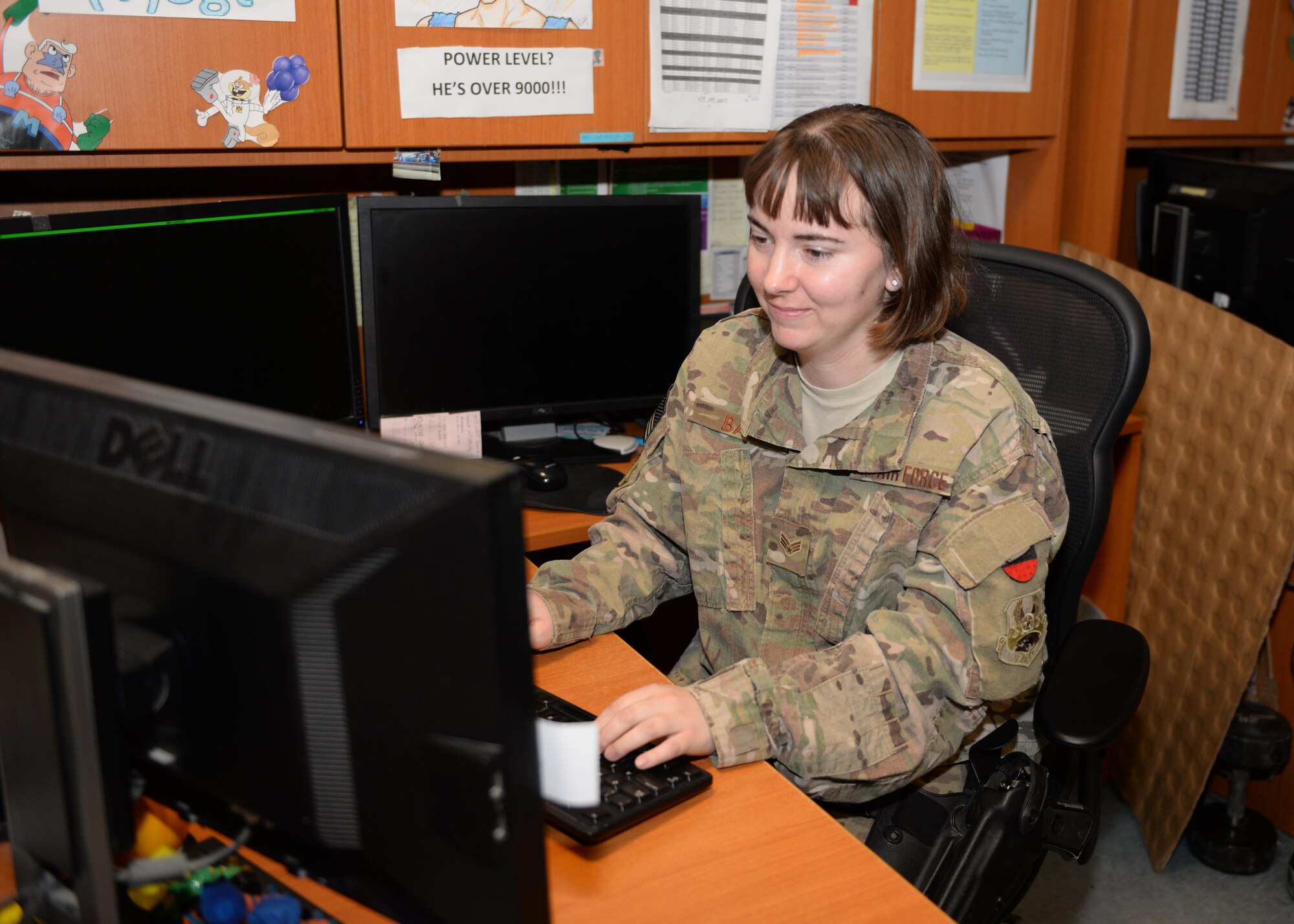 U.S. Air Force Senior Airman Sheral Bair, 455th Expeditionary Logistics Readiness Squadron log planner, works on passenger terminal schedules Aug. 4, 2015, at Bagram Airfield, Afghanistan. Bair is a member of the PAX terminal team who is responsible for ensuring all Bagram Airmen redeploy back to home station when they reach the end of their tour here. (U.S. Air Force photo by Senior Airman Cierra Presentado/Released)