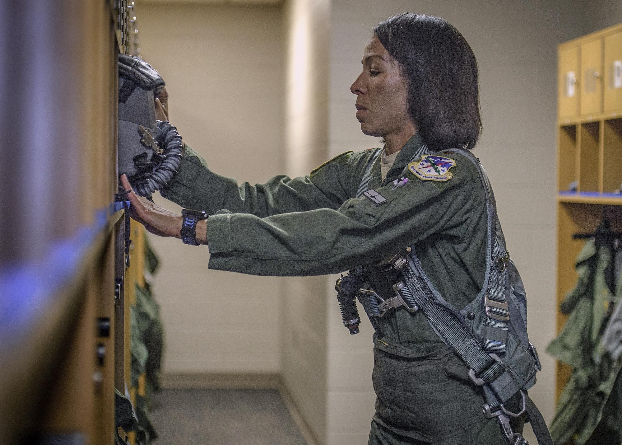 Maj. Christina Hopper, a 5th Flying Training Squadron instructor pilot, preps for an upcoming instruction flight at the life support building at Vance Air Force Base, Oklahoma, July 20. (U.S. Air Force photo by David Poe)