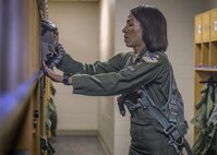 Maj. Christina Hopper, a 5th Flying Training Squadron instructor pilot, preps for an upcoming instruction flight at the life support building at Vance Air Force Base, Oklahoma, July 20. (U.S. Air Force photo by David Poe)