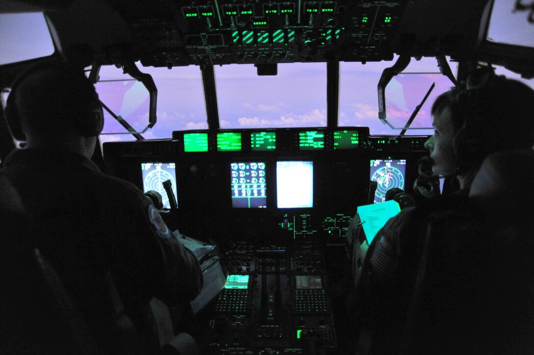 Lt. Col. Jim Hitterman, 53rd Weather Reconnaissance Squadron aircraft commander, and Maj. Devon Meister, co-pilot, fly into Tropical Storm Guillermo off the coast of Hawaii Aug. 3, 2015, to gather meteorological data for the Central Pacific Hurricane Center. (U.S. Air Force photo/Maj. Marnee A.C. Losurdo) 
